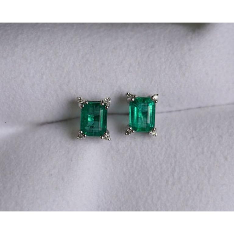 Emerald Weight: 2.04 CT, Measurements: 7x5 mm, Diamond Weight: 0.07 CT 1.3 mm, Metal: 18K White Gold, Gold Weight: 1.92 gm, Shape: Emerald-Cut, Color: Light Green, Hardness: 7.5-8, Birthstone: May