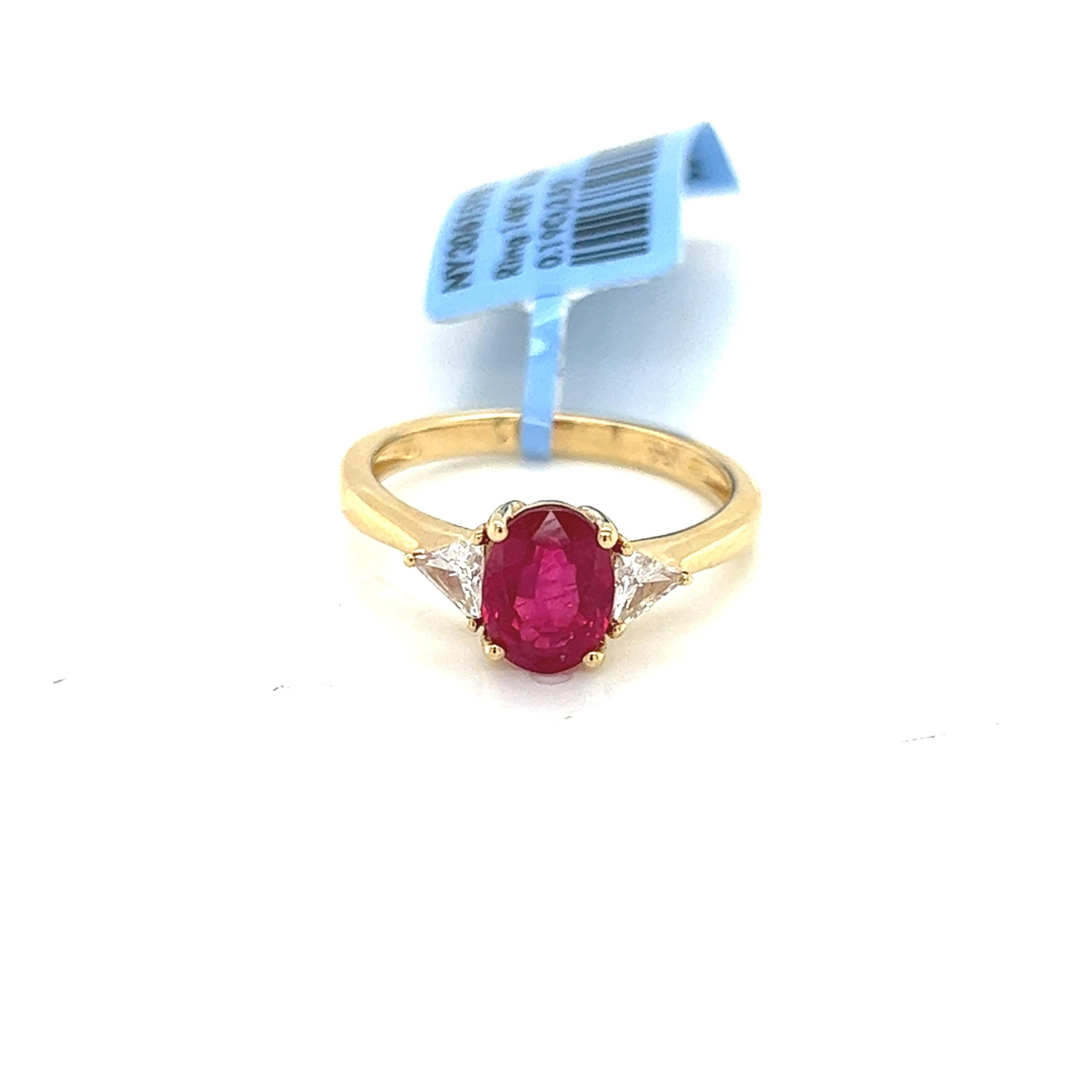 Introducing our stunning 2.04 Carat Ruby and Diamond Trillion Three Stone Ring, the perfect combination of elegance and sophistication. This exquisite ring features a 2.04 carat natural ruby, of exceptional quality and color, and two trilliant-cut