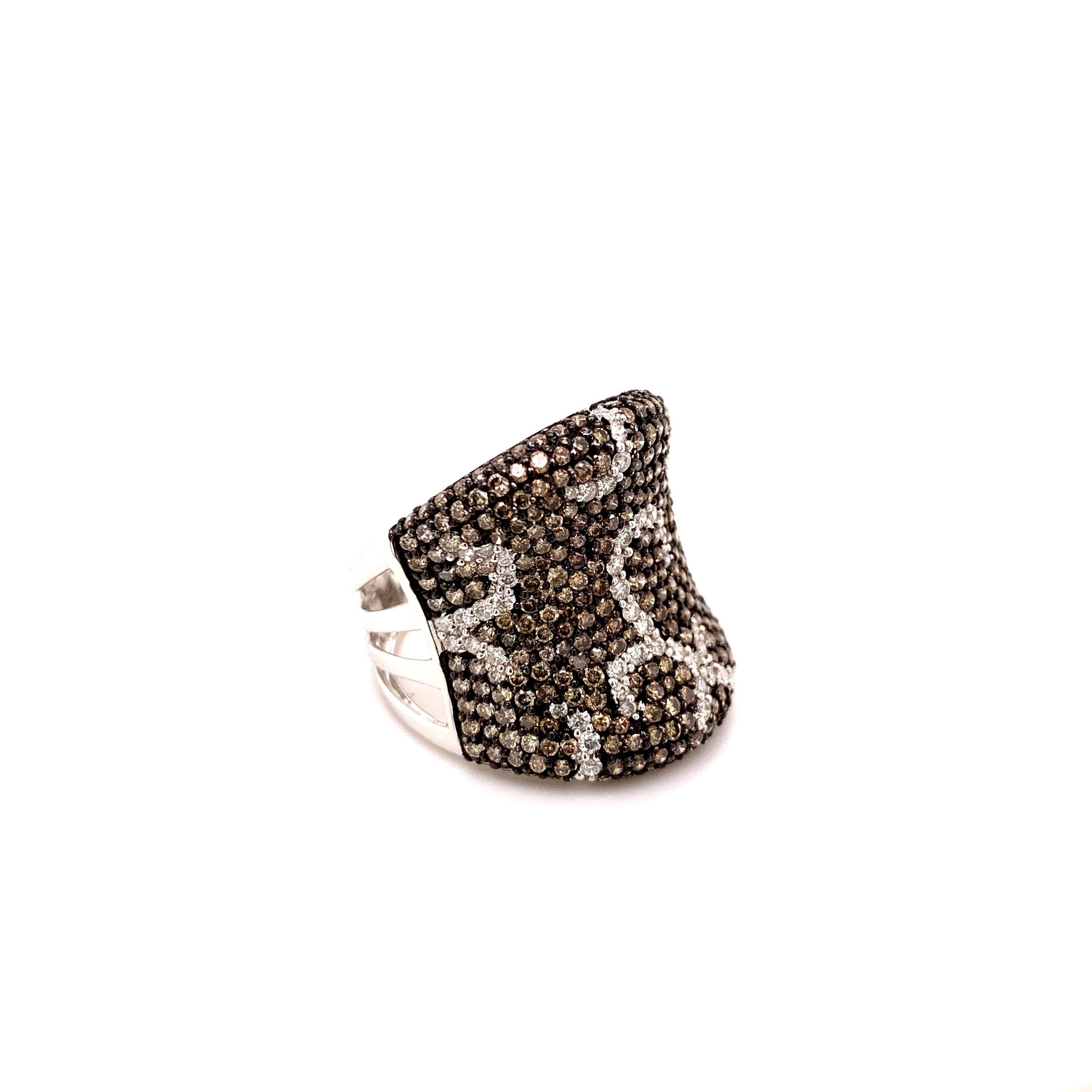 Stunning fancy brown diamond cocktail ring. Sparkling round brilliant cut 2.04 carats fancy brown diamond accented with round brilliant cut white diamond in a swirl design. The contemporary handcrafted wide band set in high polished 18 karats white
