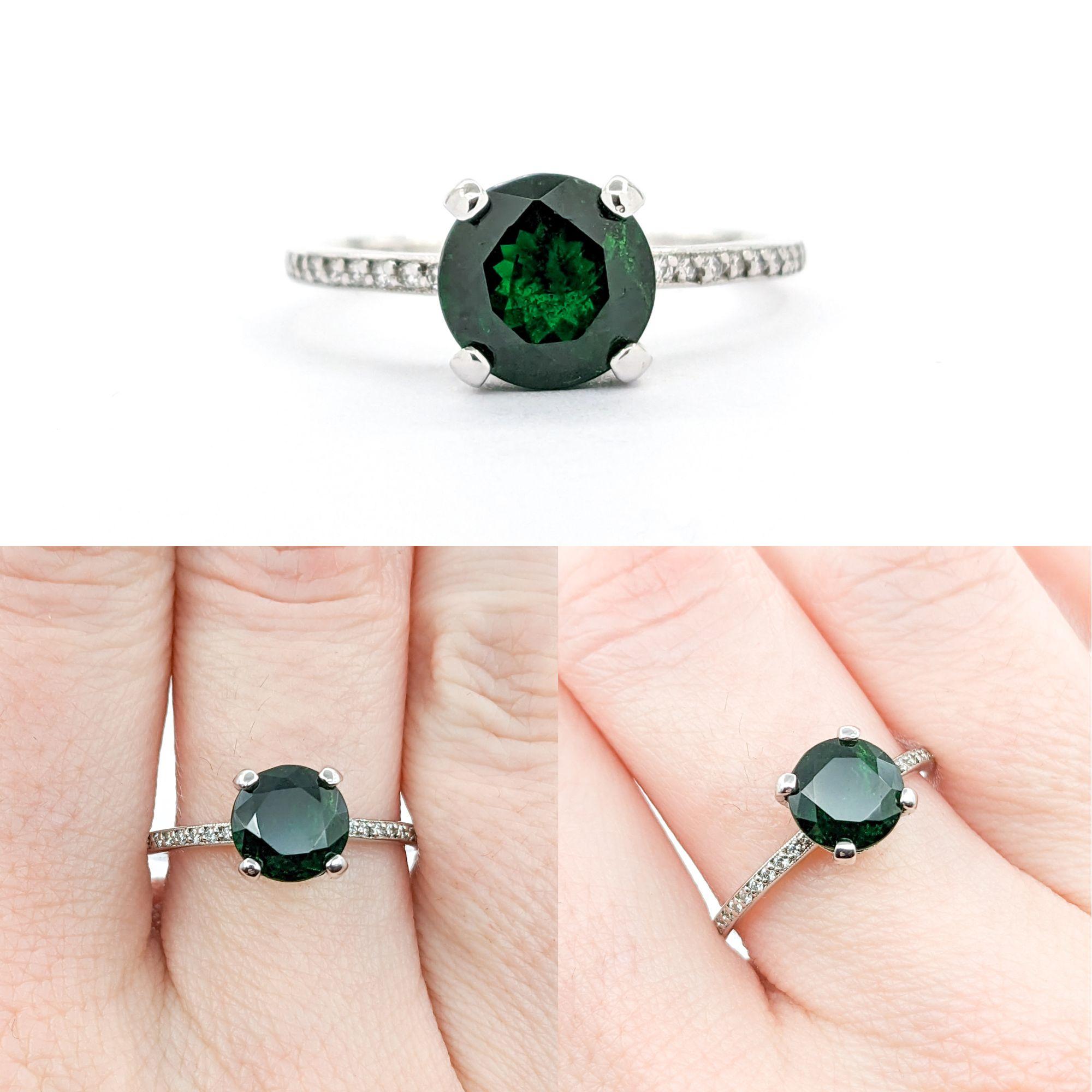 2.04 Tsavorite Garnet and Diamond Ring in 18k White Gold

This stunning ring features a 2.04ct Tsavorite Garnet centerpiece complemented by 0.25ctw of round Diamonds. These diamonds are of SI clarity and exhibit a near colorless white hue. The total
