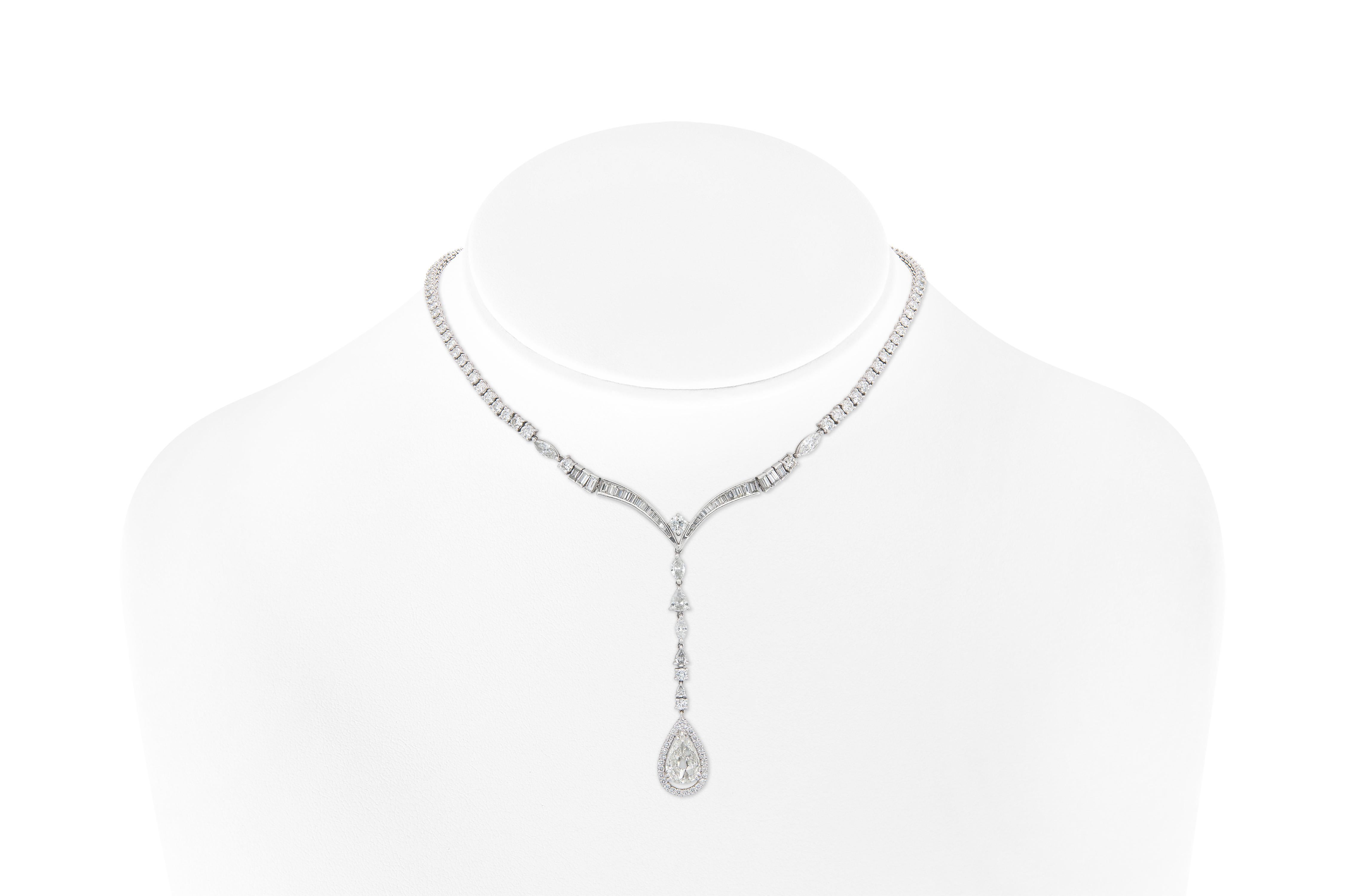 Finely crafted in platinum with a Pear-Shaped Diamond drop weighing approximately 3.00 carats, as well as smaller Pear-Shaped, Round Brilliant, Baguette, and Marquise cut Diamonds weighing approximately a total of 17.40 carats
17 inches long, 2 5/8