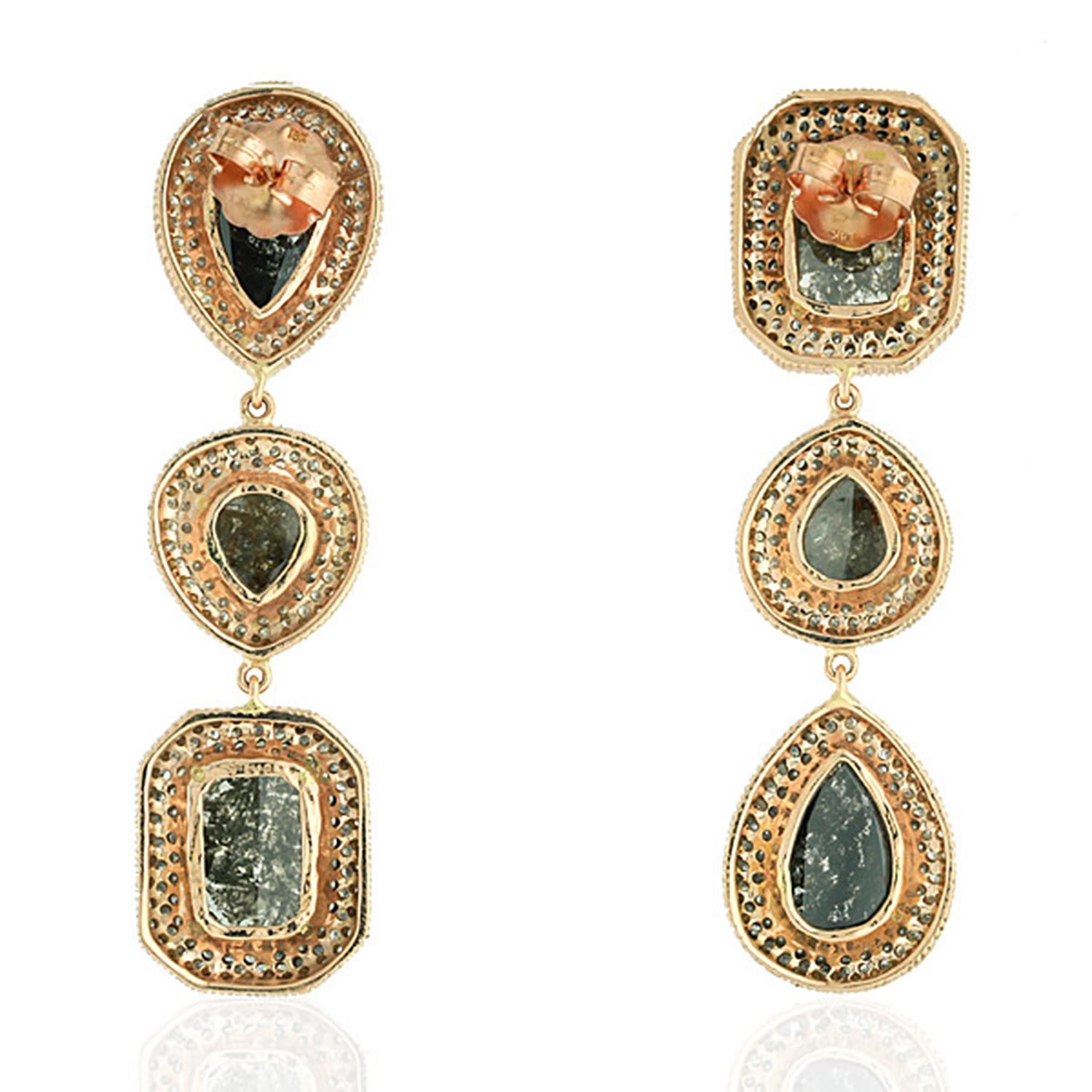 Cast from 14-karat gold, these stunning mismatched earrings are hand set with 20.41 carats of fancy natural diamonds. The rough diamonds are covered in a surface of light-reflecting facets.

FOLLOW  MEGHNA JEWELS storefront to view the latest