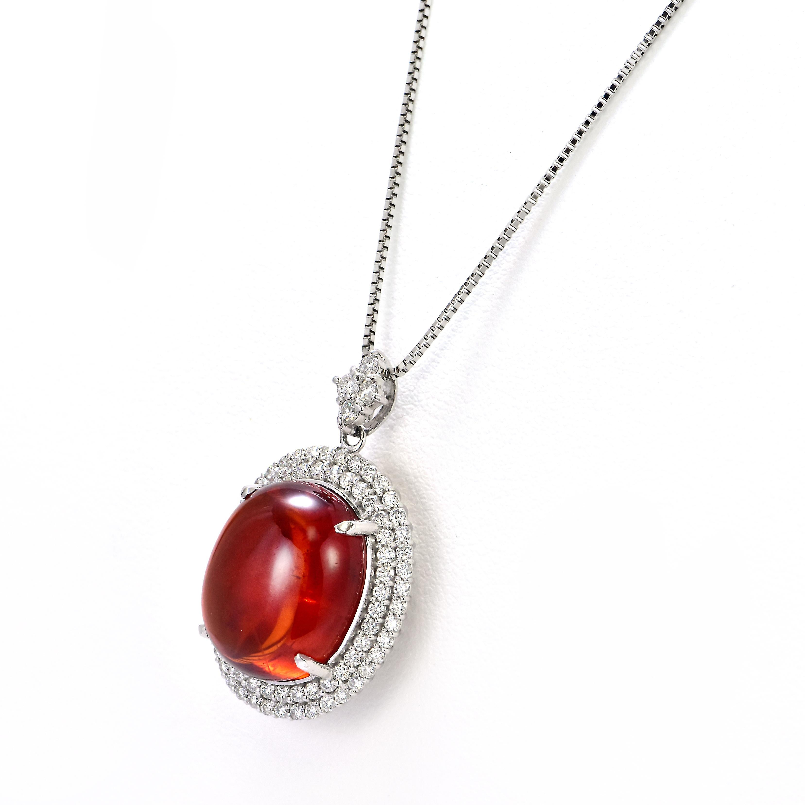 An absolutely gorgeous pendant featuring a 20.42 Carat Mandarin (Spessartine) Garnet and 0.90 Carats of Diamond Accents set Platinum. Garnets have been adorned by humans throughout history from Ancient Egypt, Rome and Greece. They come in a wide