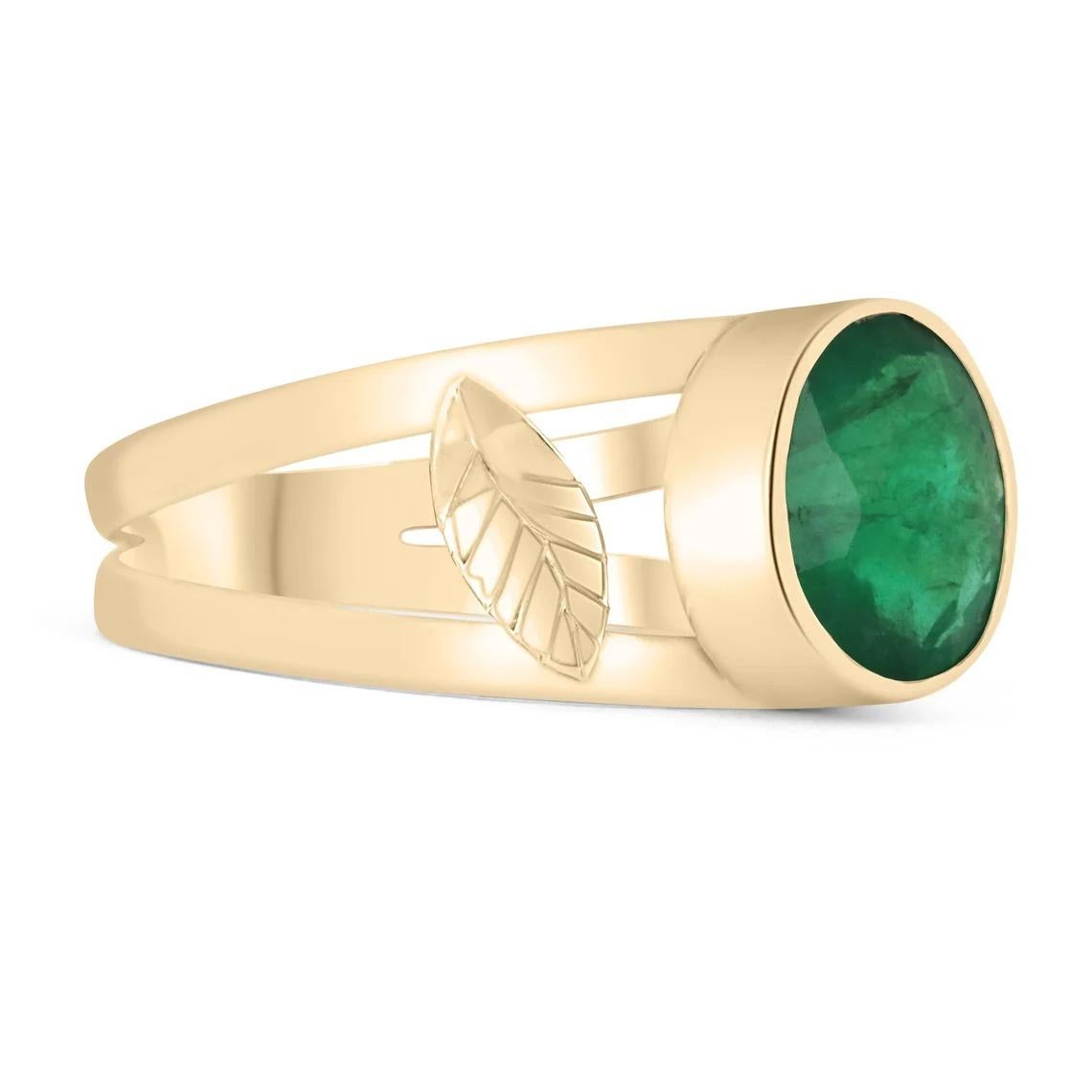 Displayed is a stunning natural emerald, oval-cut gold ring. This custom piece is extremely unique, with it's vintage detail along the shank. This natural oval-cut emerald showcases gorgeous dark green color and good luster. The stone is set
