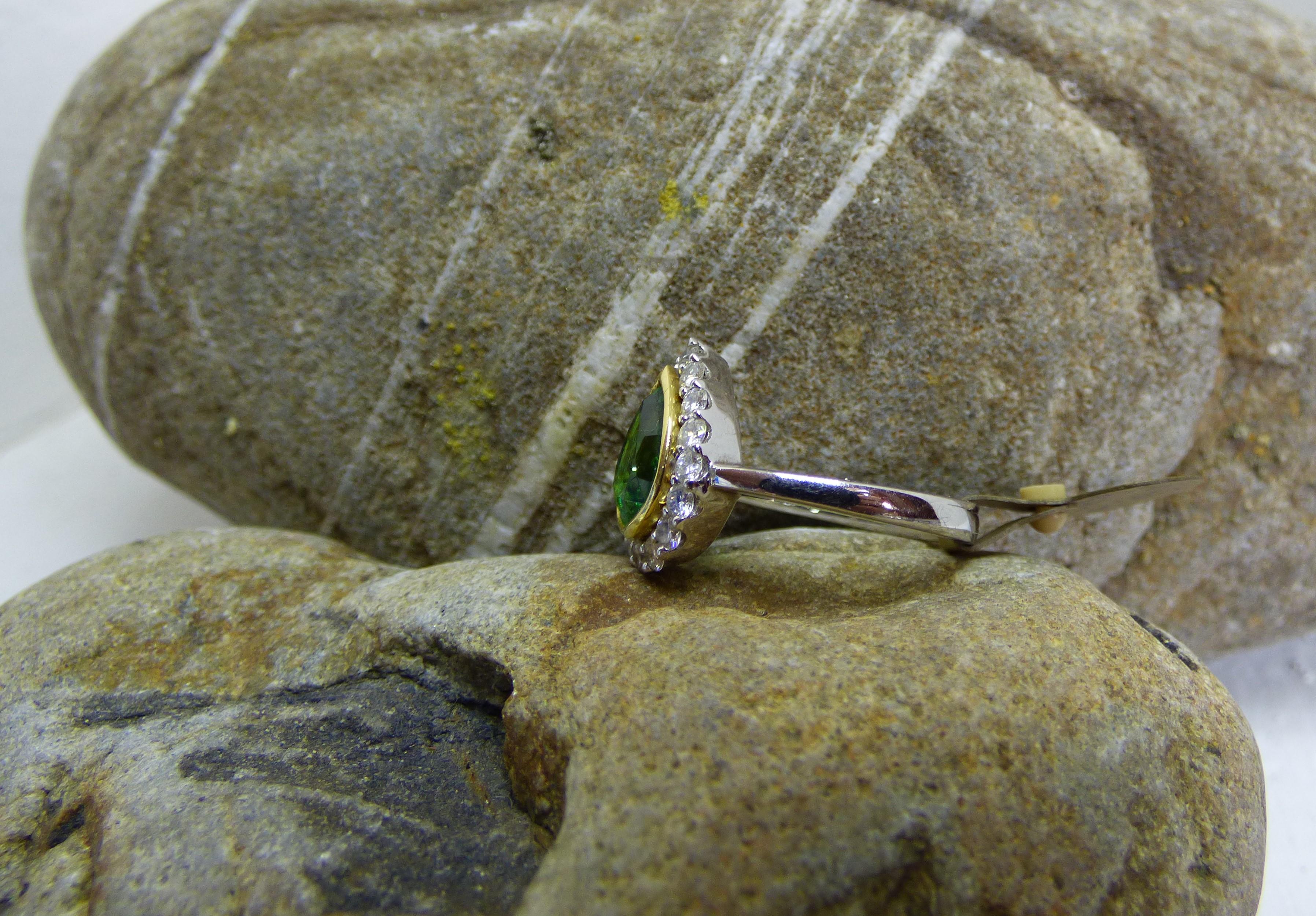 Contemporary 2.04ct Pear Shaped Tsavorite Garnet and Diamond Cluster Ring in 18K Gold For Sale
