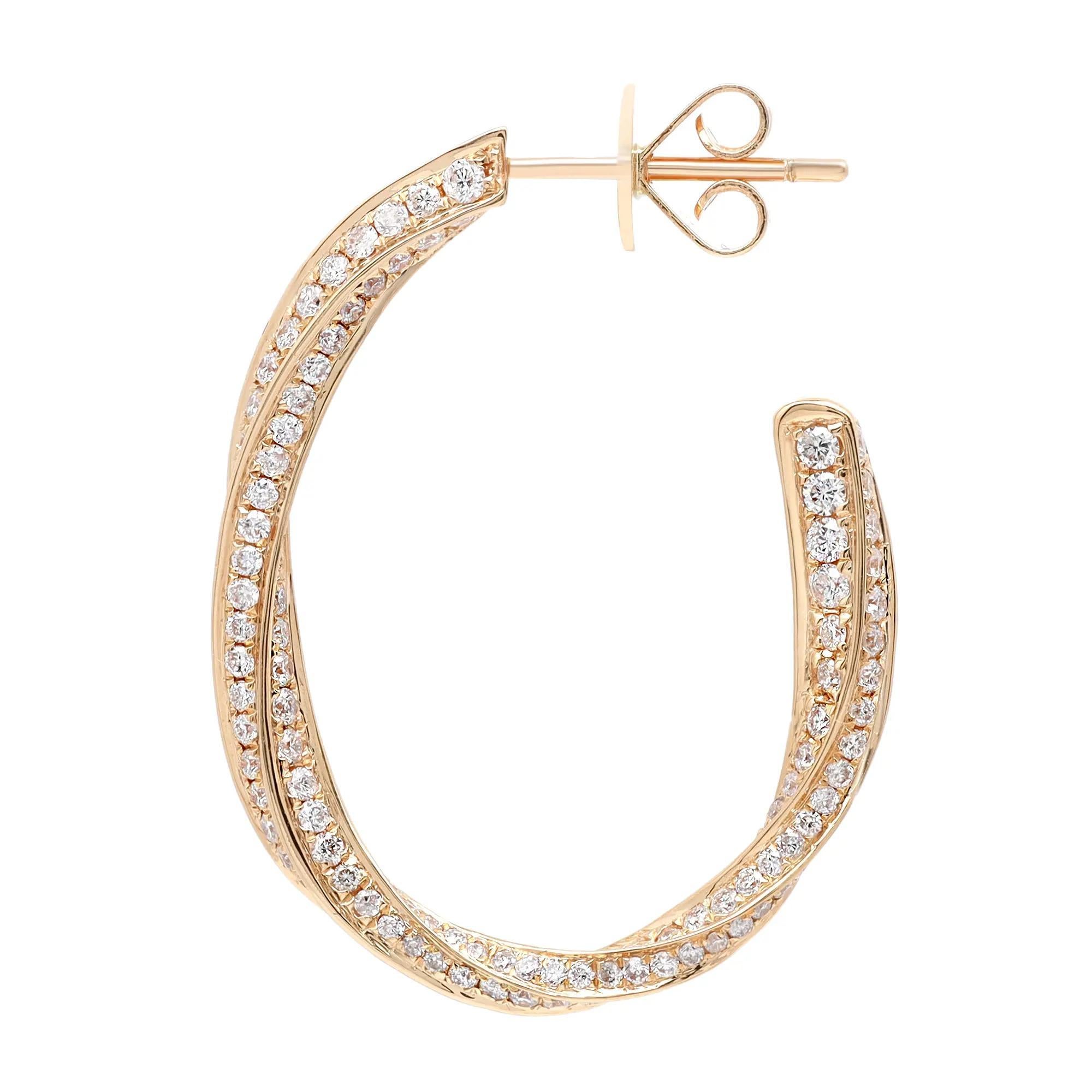 Dainty and dazzling diamond hoop earrings, perfect for a standout look. These earrings are crafted in fine high polished 18K yellow gold and pave set with bright white round cut diamonds weighing 2.04 carats. Diamond quality: color G-H and clarity