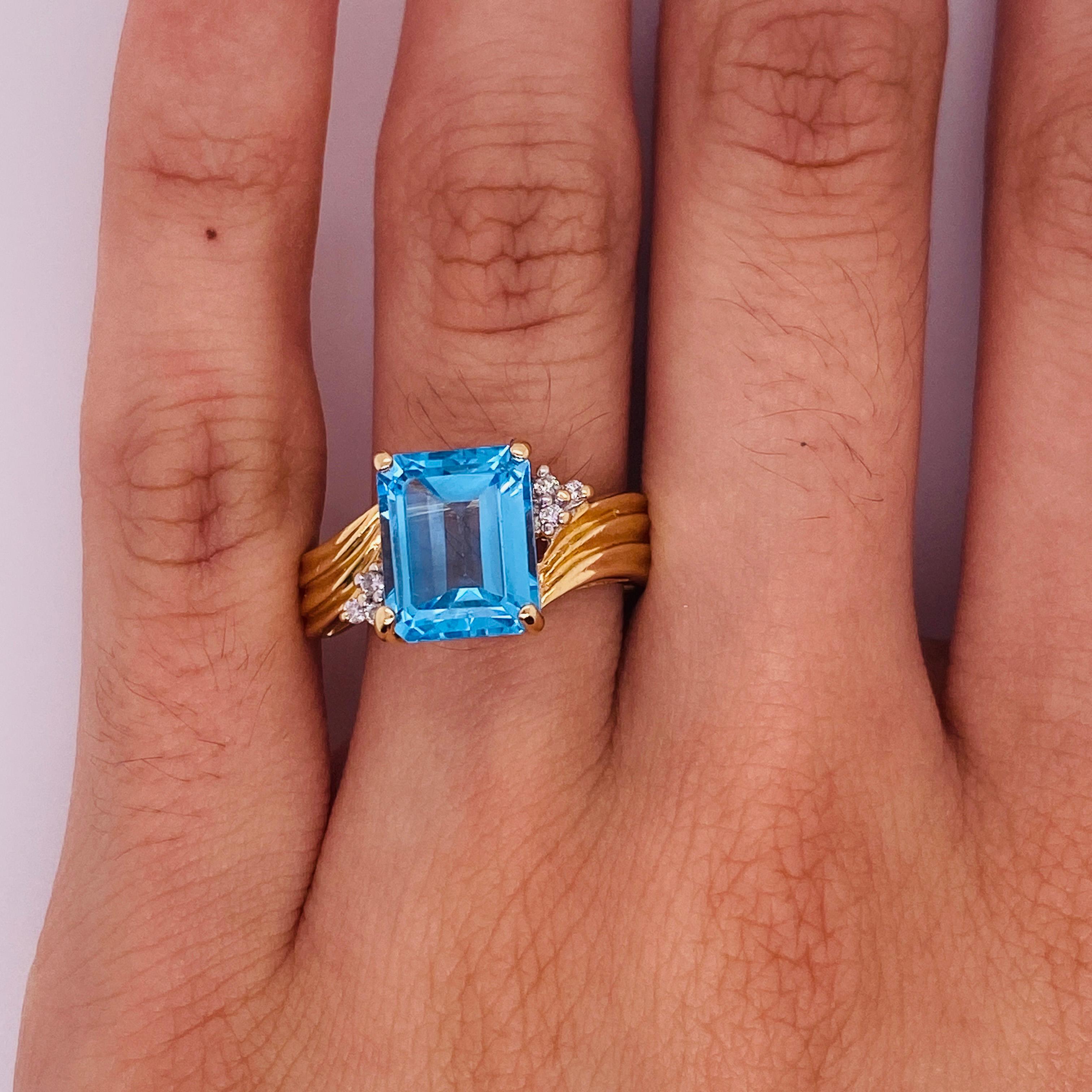Celebrate a December loved one with this beautiful birthstone ring that holds a perfect harmony of bold straight lines and sweeping curves. This ring shines brightest on the hand! The blue topaz is the blue of a vibrant ocean with the curving