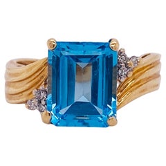 2.05 Carat Bright Ocean Blue Topaz, 14k Gold Wave Ring with Diamond Accents