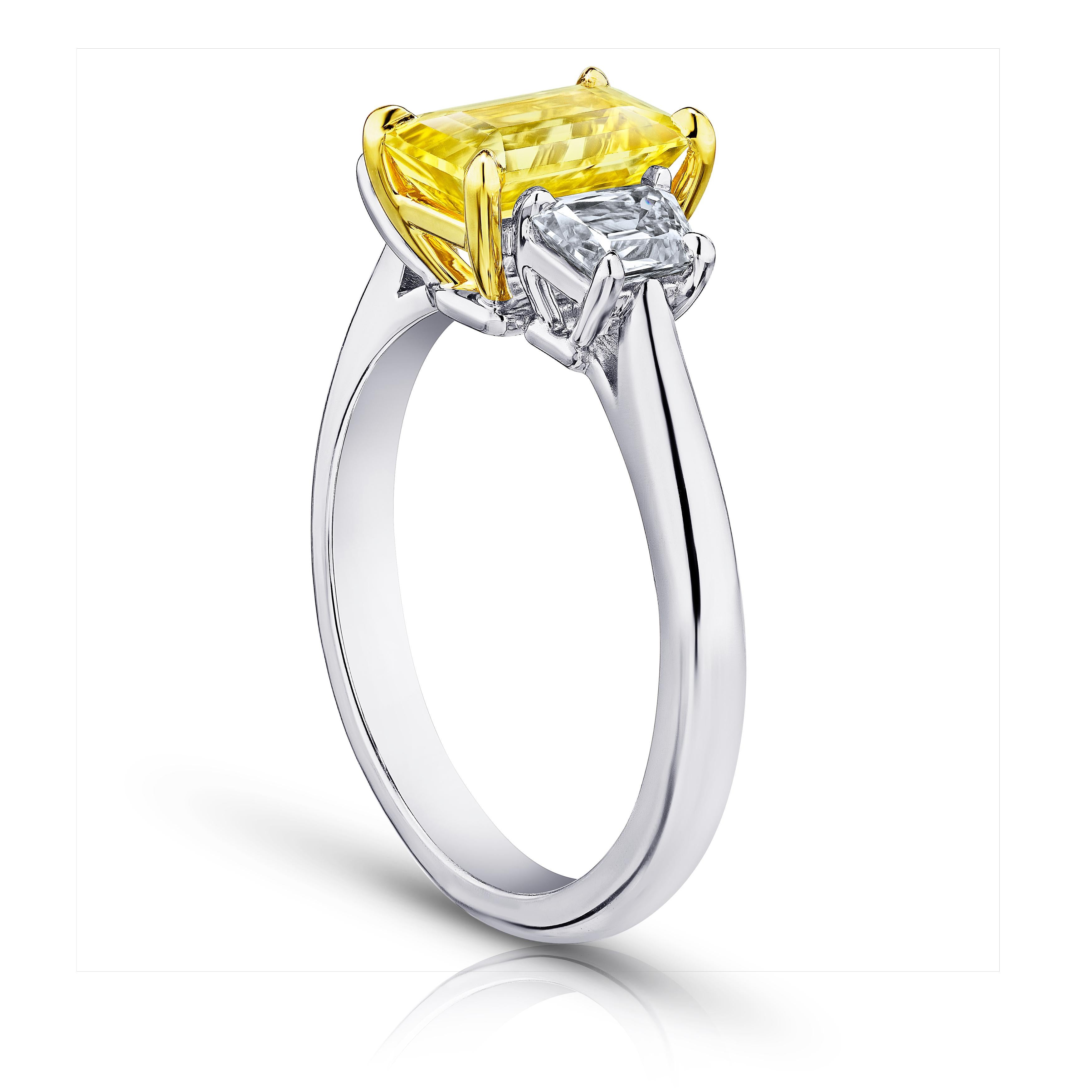 2.05 carat emerald cut yellow sapphire (no heat) with trapezoid diamonds .72 carats set in a platinum with 18k yellow gold ring