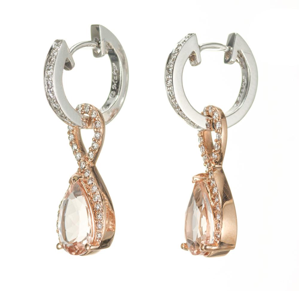 Morganite and diamond dangle earrings. 2 pear shaped morganites totaling 2.05cts set in 14k rose and white gold settings with 76 round accent diamonds.  

2 pear shaped brownish pink morganites, approx. 2.05cts
76 round diamonds, H-I VS approx.