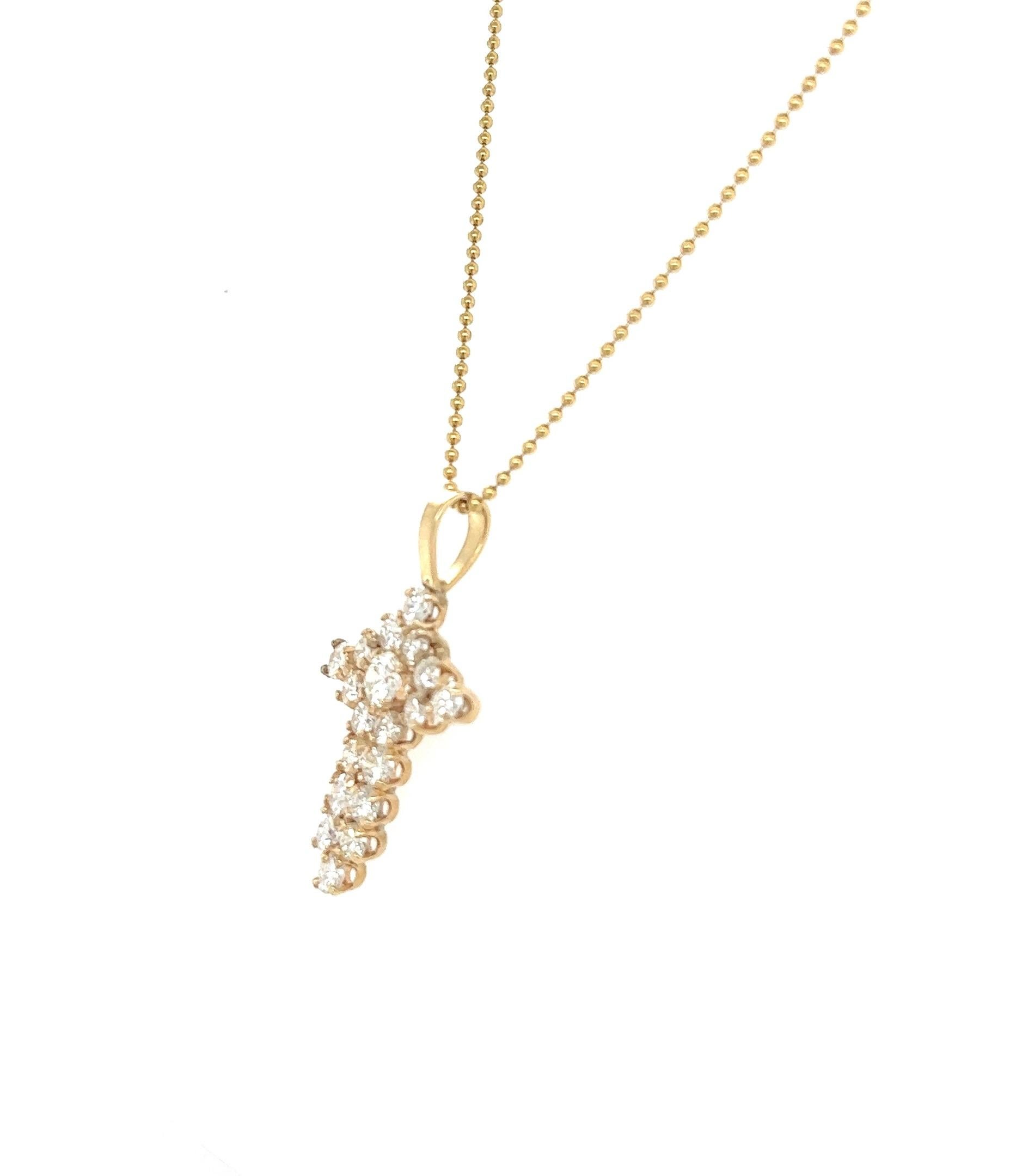 This beautiful cross pendant has 2.05 carats of Natural Round Cut Diamonds. The clarity and color is VS-I. 

Curated in 14 Karat Yellow Gold and has an approximate weight of 4.5 grams. 

The length of the chain pendant is 16 inches long. 
