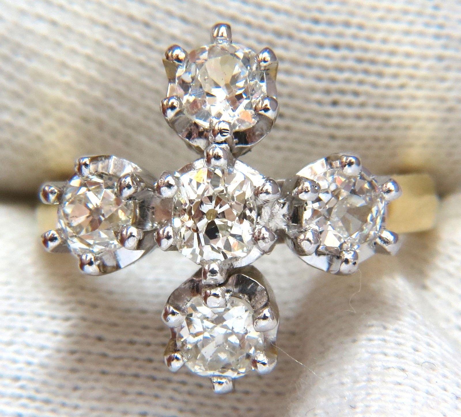 Victorian Cross Ring

2.05ct (5) Cushion cut diamonds 

I-J color si-1 clarity.

18kt Yellow gold &  Platinum

10 grams

Ring Current size: 6 3/4

Cross Deck: 18.2 X 7.8mm /

.72 X .70 inch

We may resize, please inquire.

Free Resize