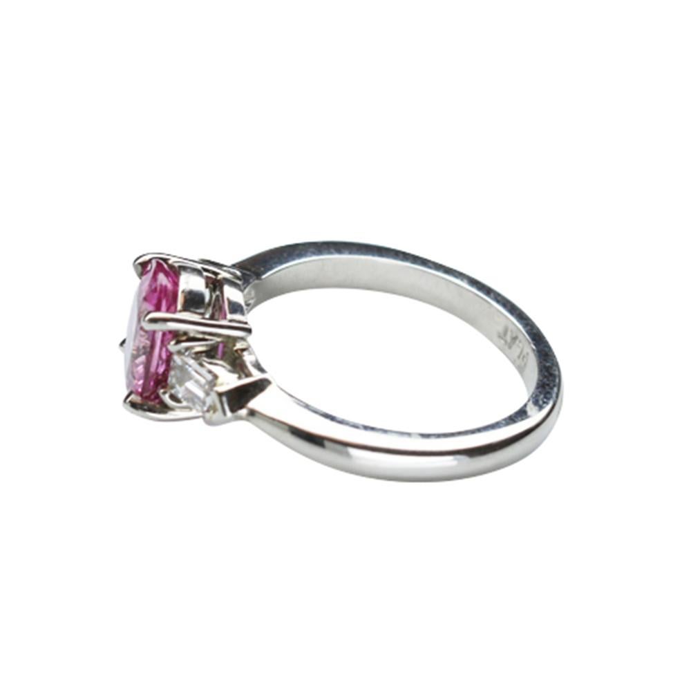 Elegant & finely detailed Solitaire Cocktail Engagement Ring, set with a securely nestled  2.05 Carat Intense  Pink oval Sapphire, clarity: VS; internally flawless (IF); dimensions: 8.6 x 6.8; either side set with Brilliant-cut Diamonds, measuring