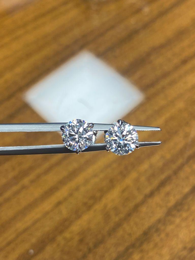 Stunning pair of Round brilliant cut Diamond Stud Earrings.
Set in hand made 18k gold on a three prong mounting. The Diamonds in these earrings we’re carefully selected to create the perfect match for these timeless earrings
2.05 total carat