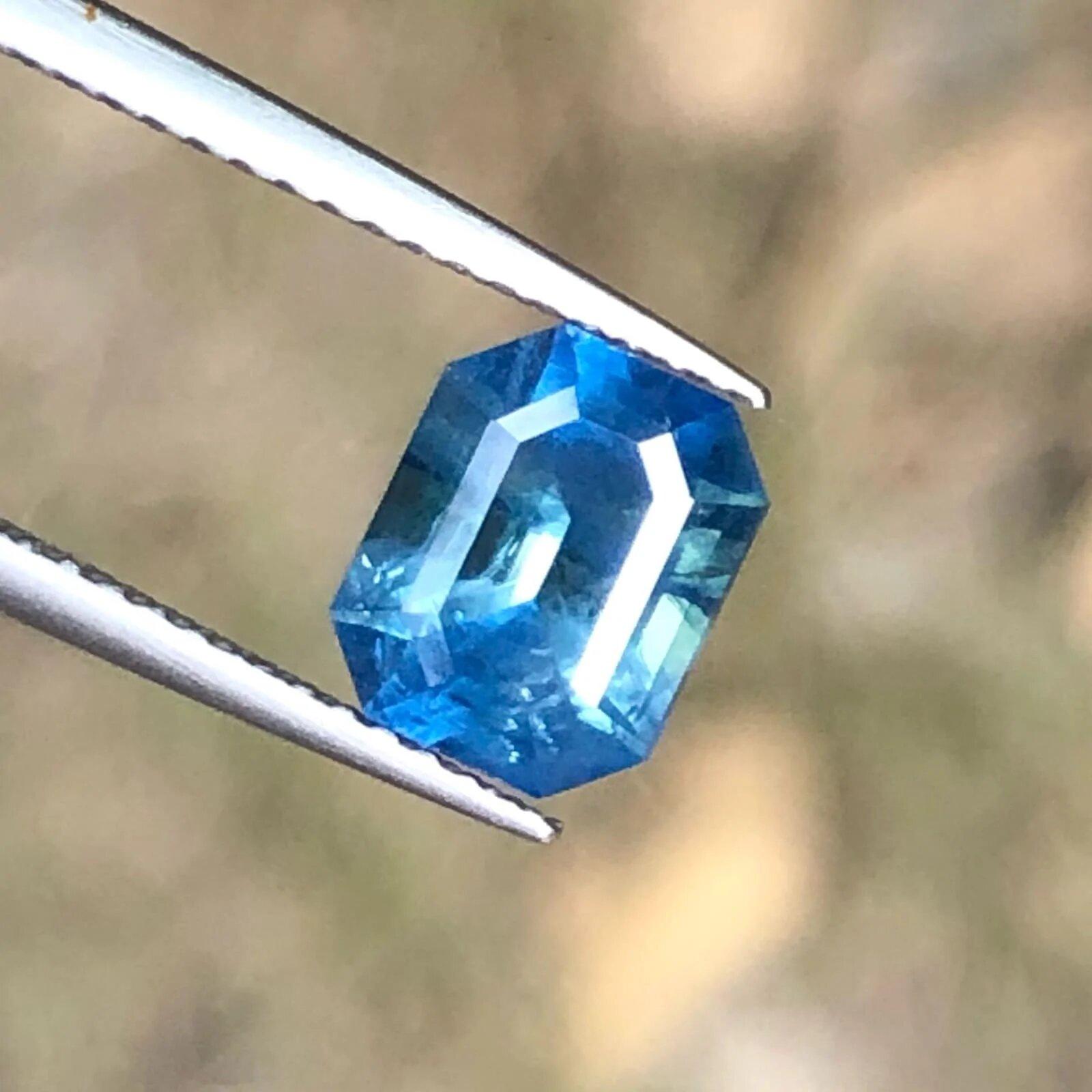 This 2.05 Carat Royal Emerald Cut Blue Sapphire was purchased from our Tanzanian Source in Thailand as a rough piece of gemstone. It was brought here keeping in mind that we will cut this piece with the help of our professional gem cutters in
