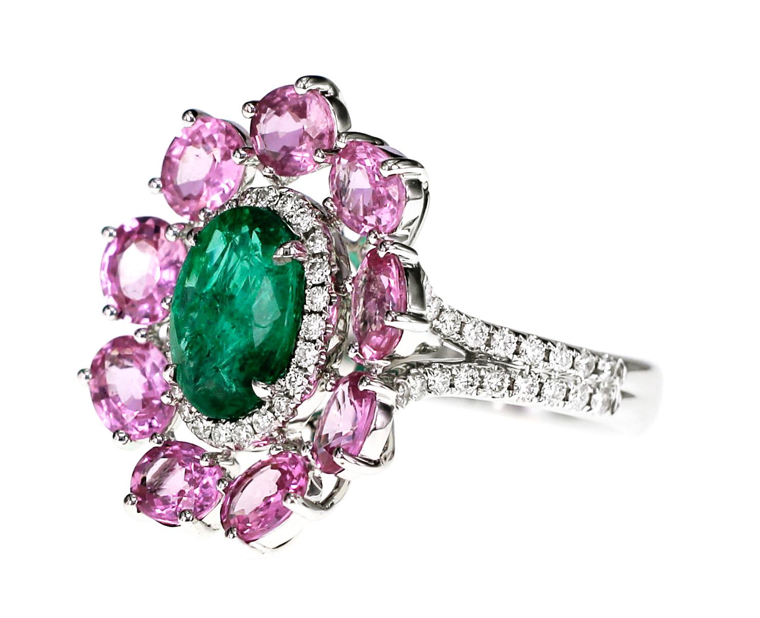 3.52 carats of Rare pink sapphire are set as halo around a 2.05 carat of vivid green emerald. The setting of the ring looks like a flower. Also 0.41 carat of F color VS clarity round brilliant white diamond are set.
Ring Size : US 6.5