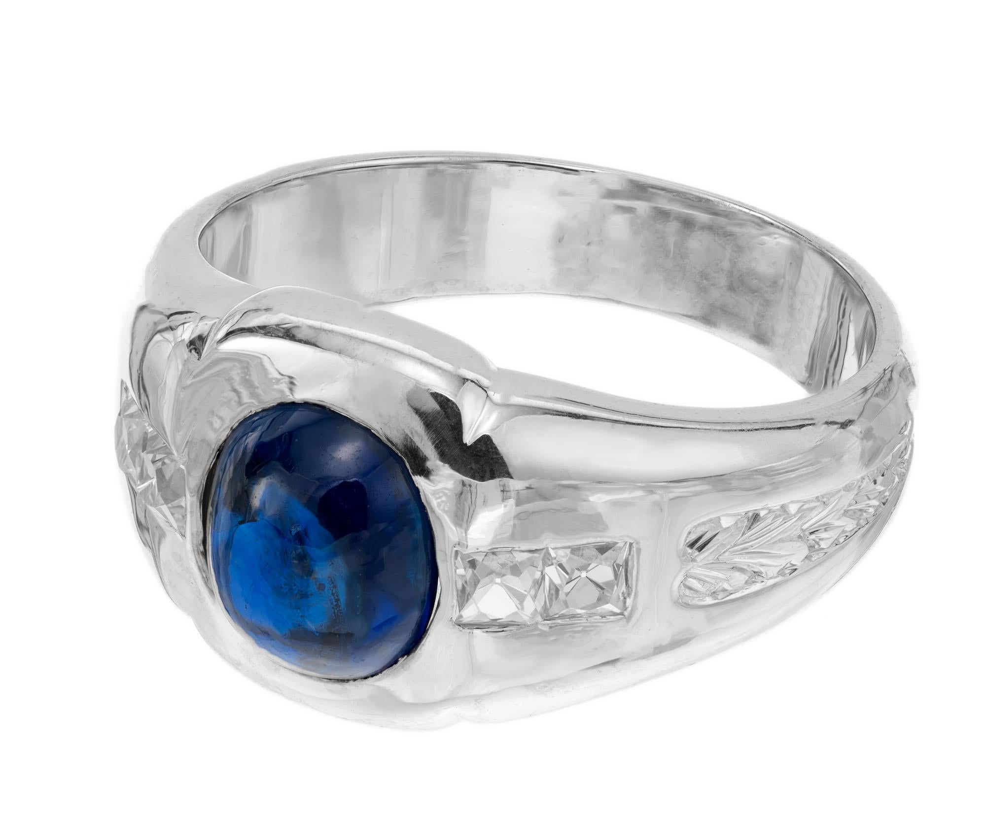 Original Art Deco handmade sapphire and diamond men's ring. AGL certified natural no heat oval cabochon sapphire center stone, accented with 4 French cut diamonds in a platinum setting. Certified by the AGL #GB109006 as natural, no heat Cambodia