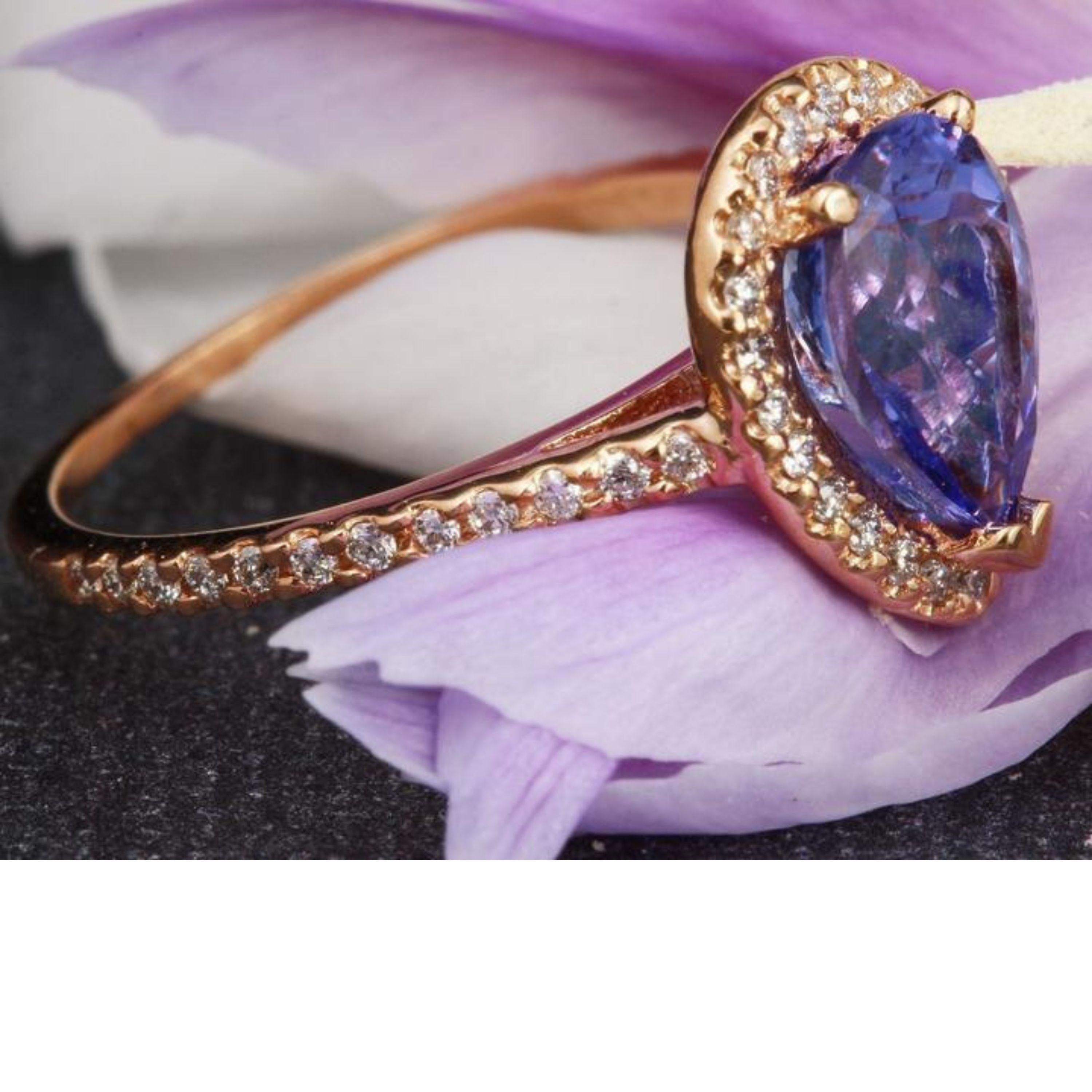 2.05 Carats Natural Very Nice Looking Tanzanite and Diamond 14K Solid Rose Gold Ring

Total Natural Pear Cut Tanzanite Weight is: 1.60 Carats

Natural Round Diamonds Weight: Approx. 0.45 Carats (color G-H / Clarity SI)

Ring size: 7 (we offer free