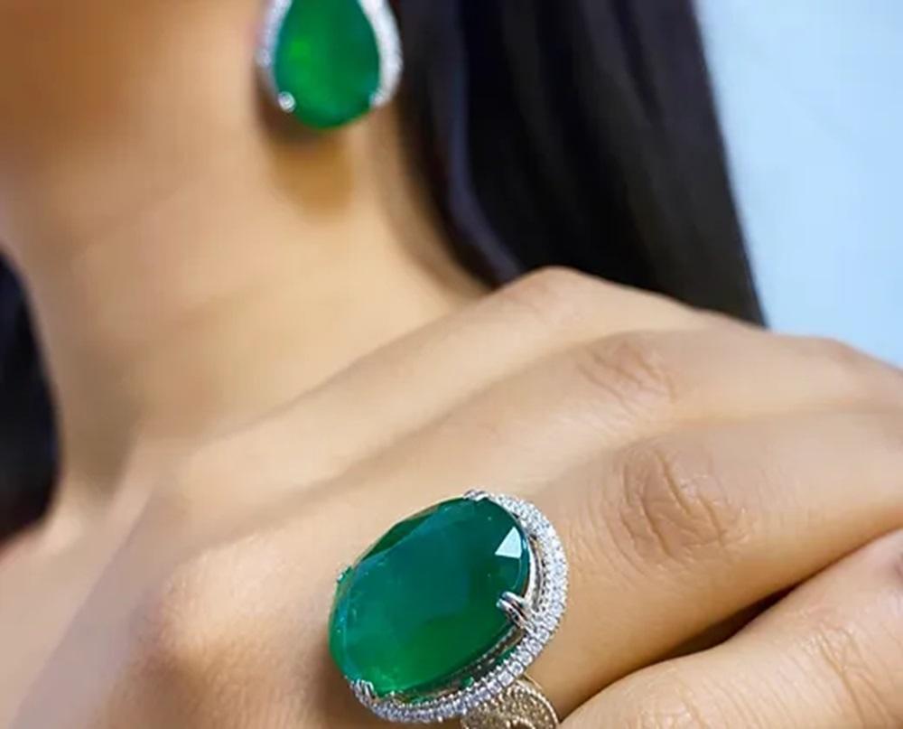 Emerald Weight: 2.05 CTS, Measurements: 8 x 7.26 mm, Diamond Weight: 1.16 CTS, Metal: 18K White Gold, Ring Size: 6.5, Shape: Cushion, Color: Green, Hardness: 7.5-8, Birthstone: May