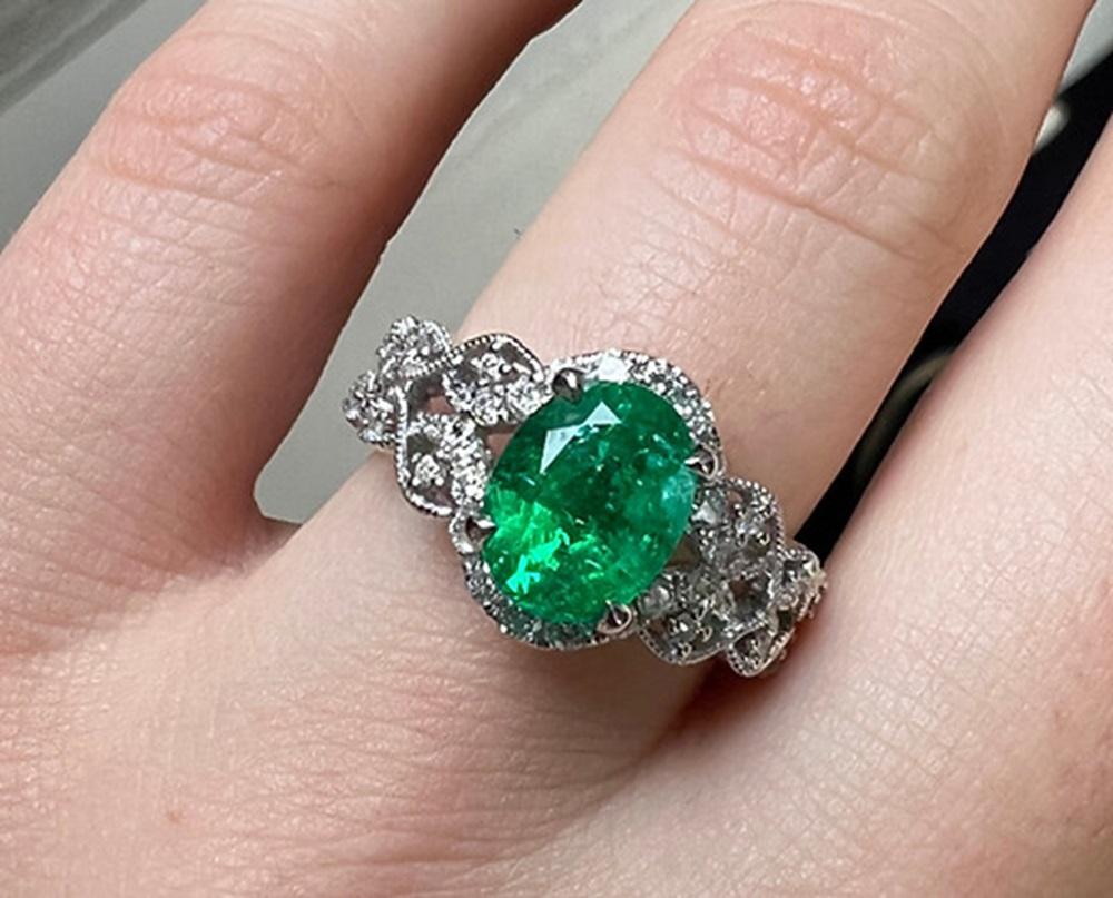 Emerald Weight: 2.05 CTS, Measurements: 9.11 x 7.04 mm, Diamond Weight: 0.40 CT, Metal: 18K White Gold, Ring Size: 6.5, Shape: Oval, Color: Green, Hardness: 7.5-8, Birthstone: May