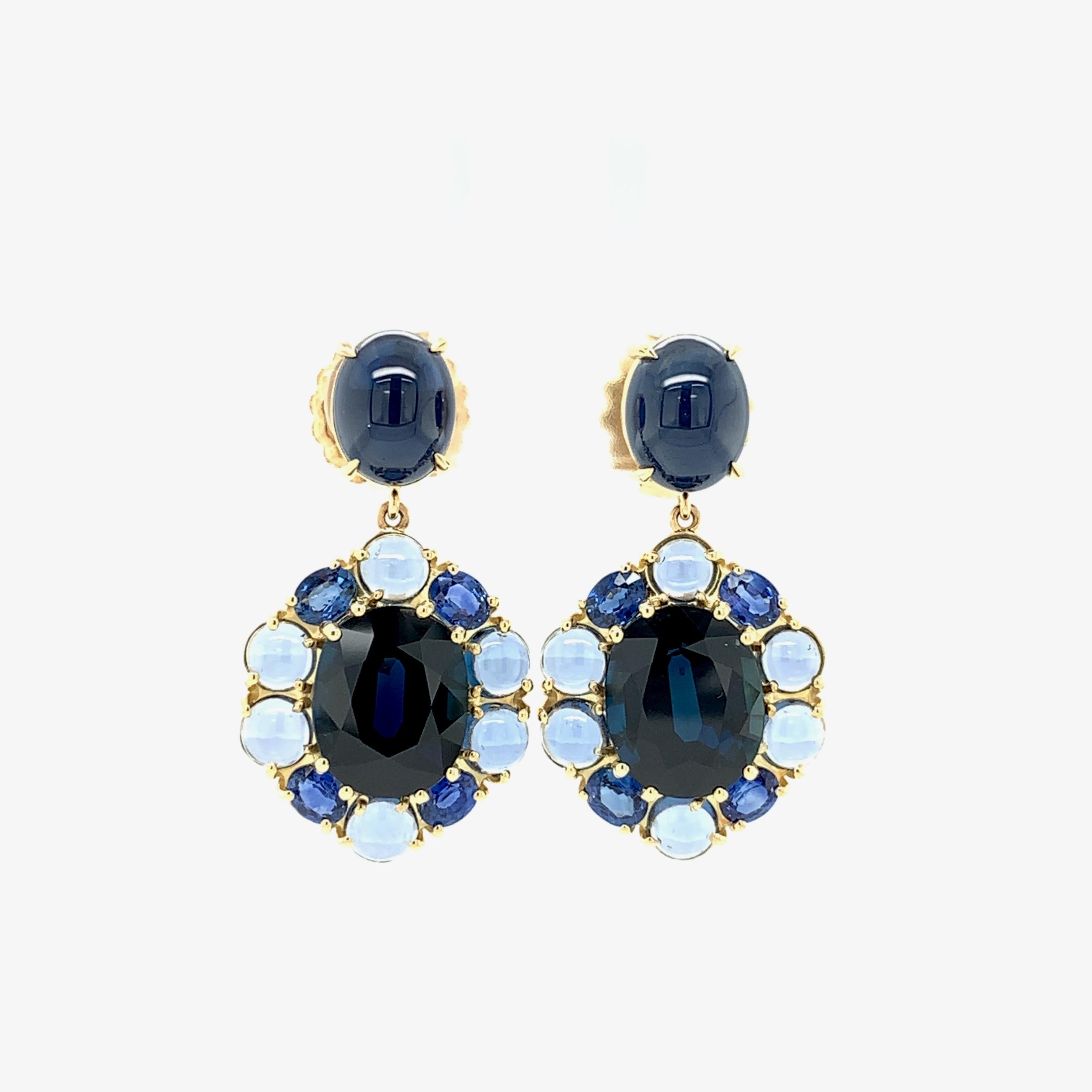 You’ll feel like royalty wearing these gorgeous earrings designed to showcase four striking shades of prized blue sapphire. Richly colored sapphire cabochon ovals sit beautifully on the earlobe as post earrings with extra large 18k yellow gold