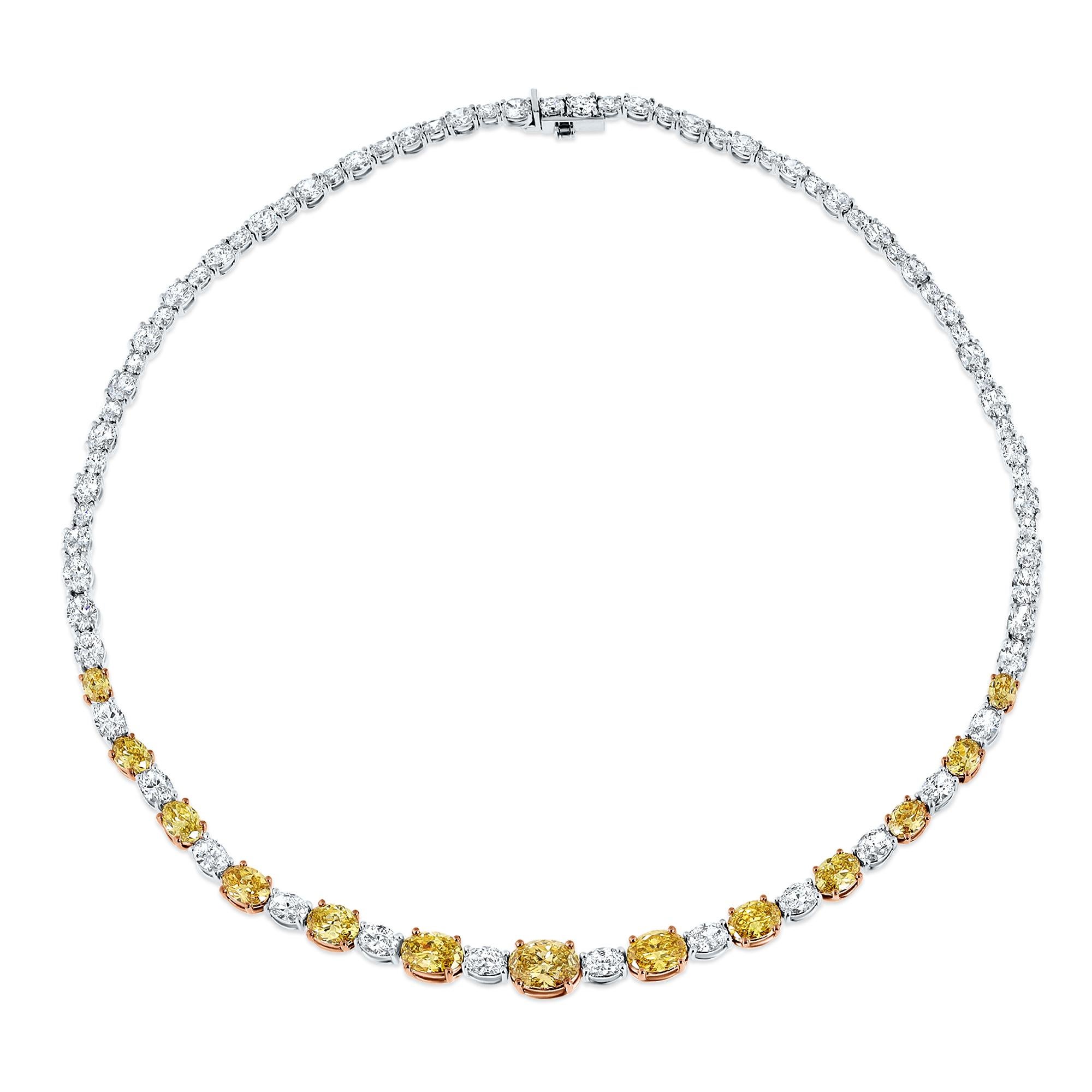 Introducing an enchanting diamond necklace fit for the red carpet, a gala, or a black-tie wedding. The luxurious combination of yellow and colorless diamonds in an oval cut is truly breathtaking and show-stopping. This exquisite piece features 13