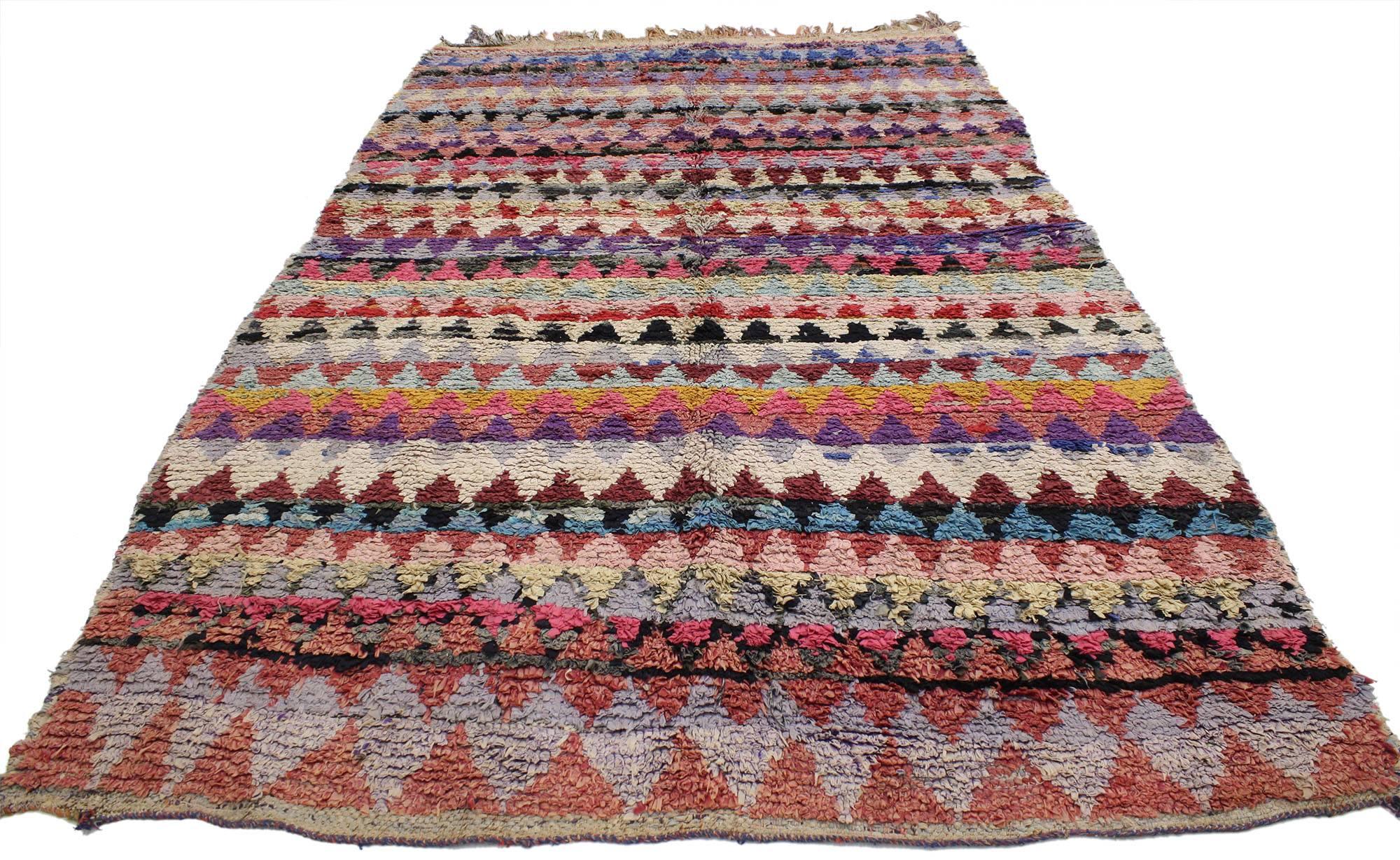 20567 Vintage Berber Moroccan Boucherouite rug. Vivacious shades of the colors woven into this piece work together to create a truly vibrant and life-giving feel. The variegated zigzag color pattern conjures the tribal feeling of Moroccan spirit in