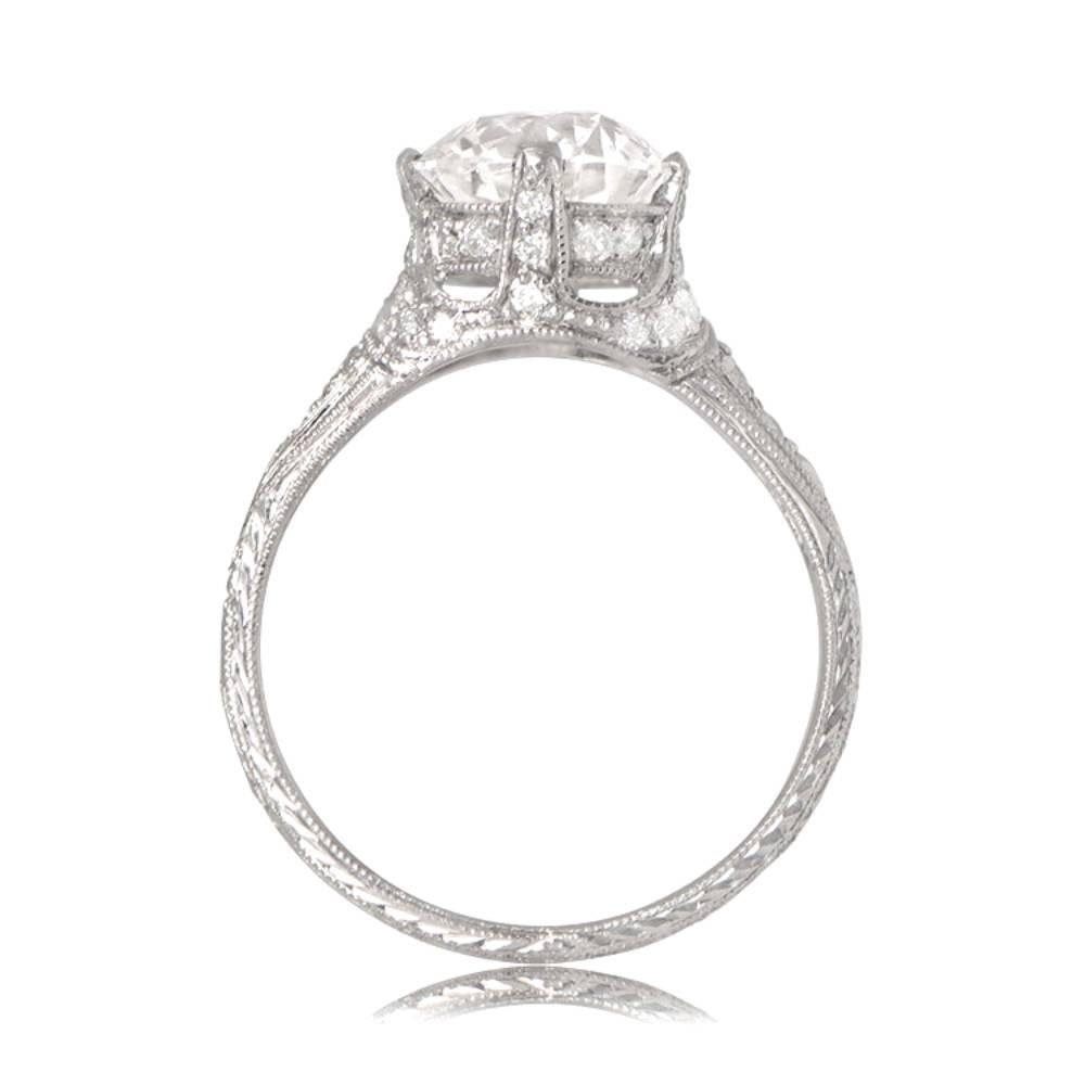 This is a stunning platinum engagement ring with a rare 2.05ct old European cut diamond (D color, VS1 clarity), adorned with additional old European cut diamonds and open-work. Hand-engraved shoulders add a final touch of elegance.

Ring Size: 6.5