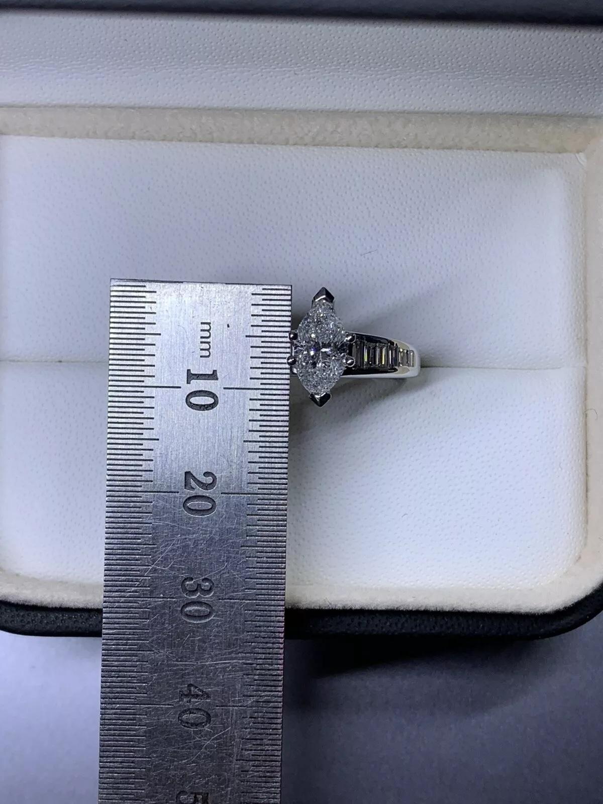 Marquise Cut 2.05ct Marquise baguette diamond engagement ring in 18k white gold. For Sale