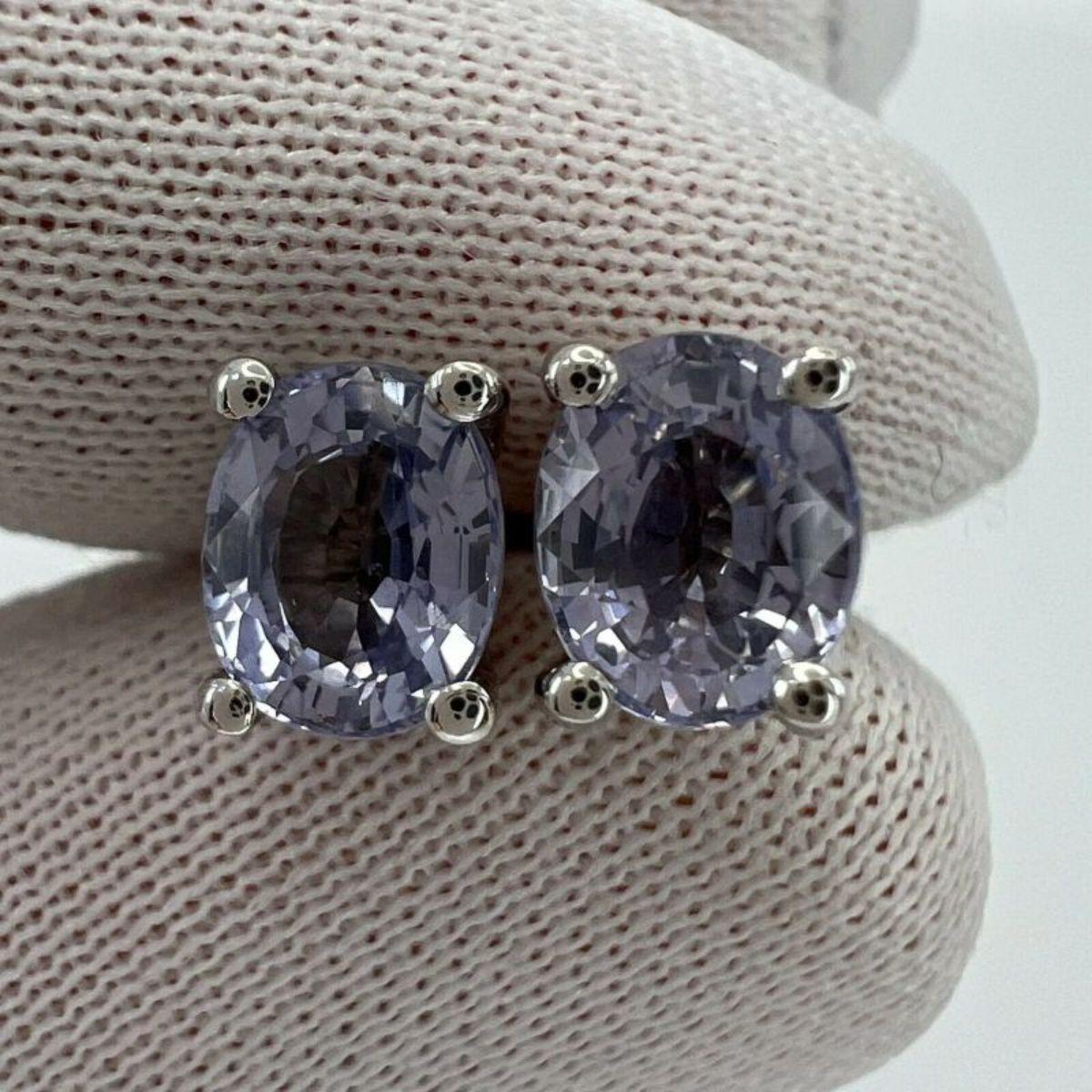 2.05ct Natural Sapphire Purple Violet 18K White Gold Oval Cut Earring Studs

Fine Pink Purple Sapphire 18k White Gold Oval Cut Earring Studs. 
Stunning natural 6x5mm vivid pink purple Sapphires in 18k white gold studs 
2.05 total carat, perfect