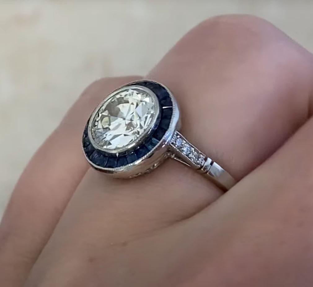 This exquisite halo and diamond engagement ring features a breathtaking approx. 2.00-carat old European cut diamond at its center, radiating timeless elegance. Graded K in color with VS1 clarity, the diamond exhibits exceptional brilliance and