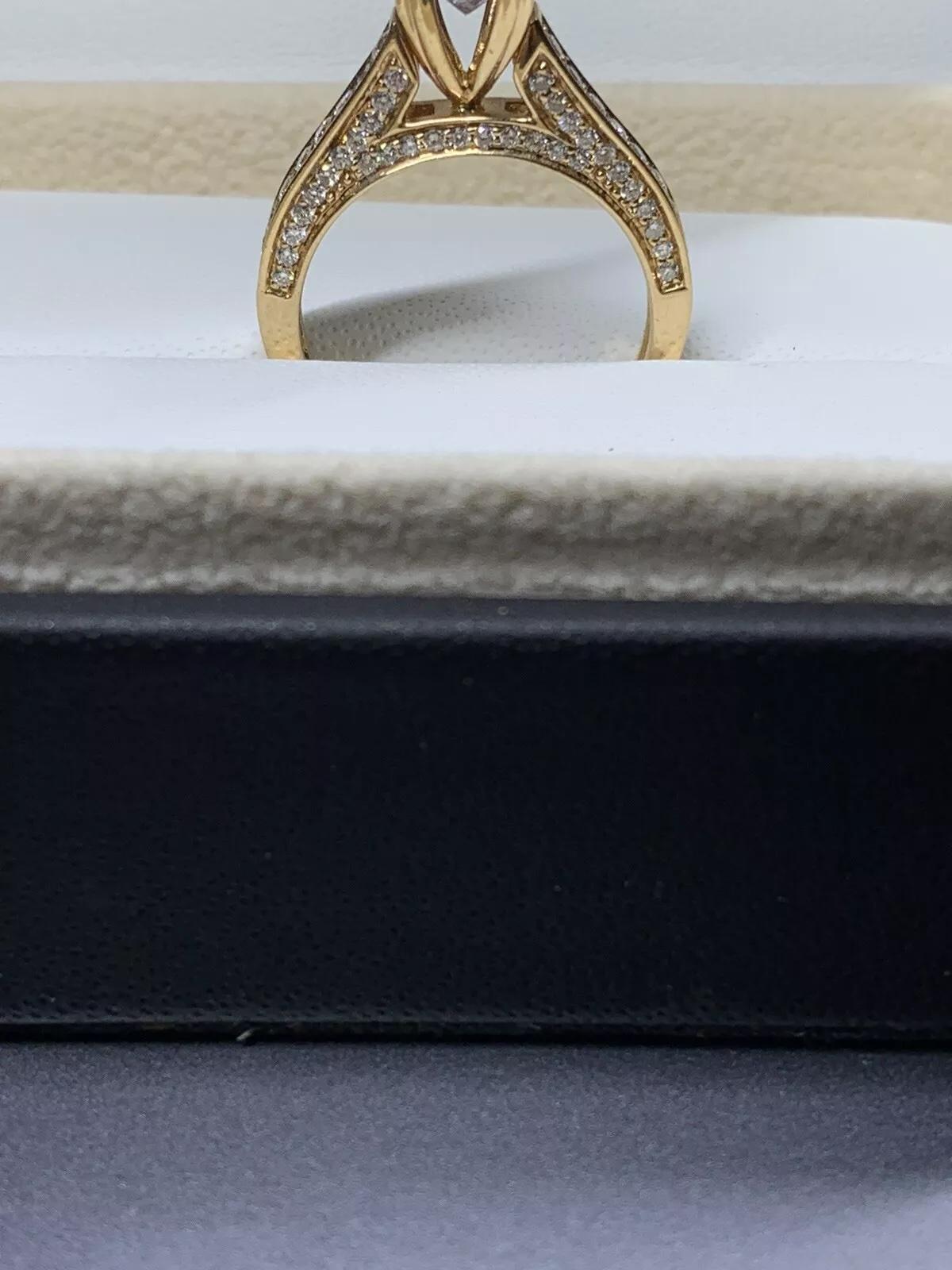 2.05ct Peach sapphire diamond engagement ring in 18k rose gold.

Pink peach sapphire gemstone cushion cut natural untreated total weight 1.05ct

chunky p18ct pink gold solitaire engagement ring with hidden diamond halo.

Hallmarked.

Diamonds total