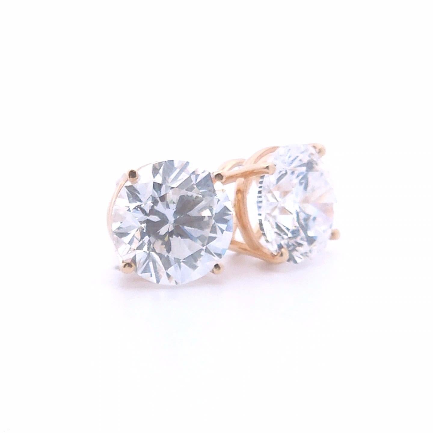 Elevate your elegance with these stunning 2.05ct Round Diamond Stud Earrings, set in lustrous 14k Yellow Gold. Each earring features a brilliant round-cut diamond that catches the light from every angle, showcasing exceptional clarity and sparkle.
