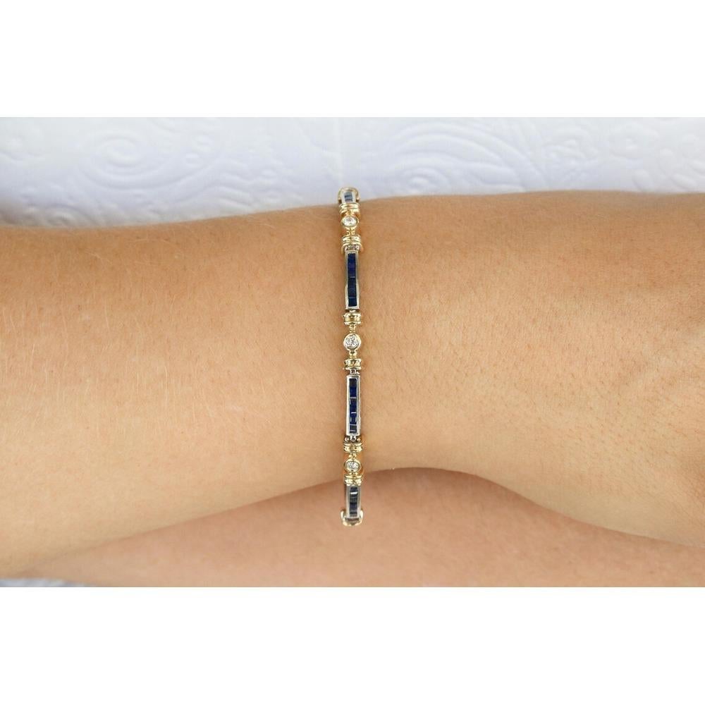 A regal blue sapphire and diamond tennis bracelet. Handcrafted in 14K yellow and white gold, this piece features princess cut sapphires in a white gold channel set link. Alternating beautifully, brilliant round diamonds are bezel set in golden