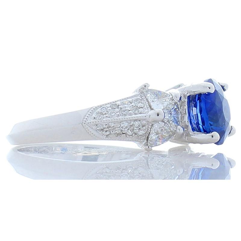Round Cut 2.06 Carat Blue Sapphire and Trillion Diamond Cocktail Ring in 18 Karat Gold For Sale
