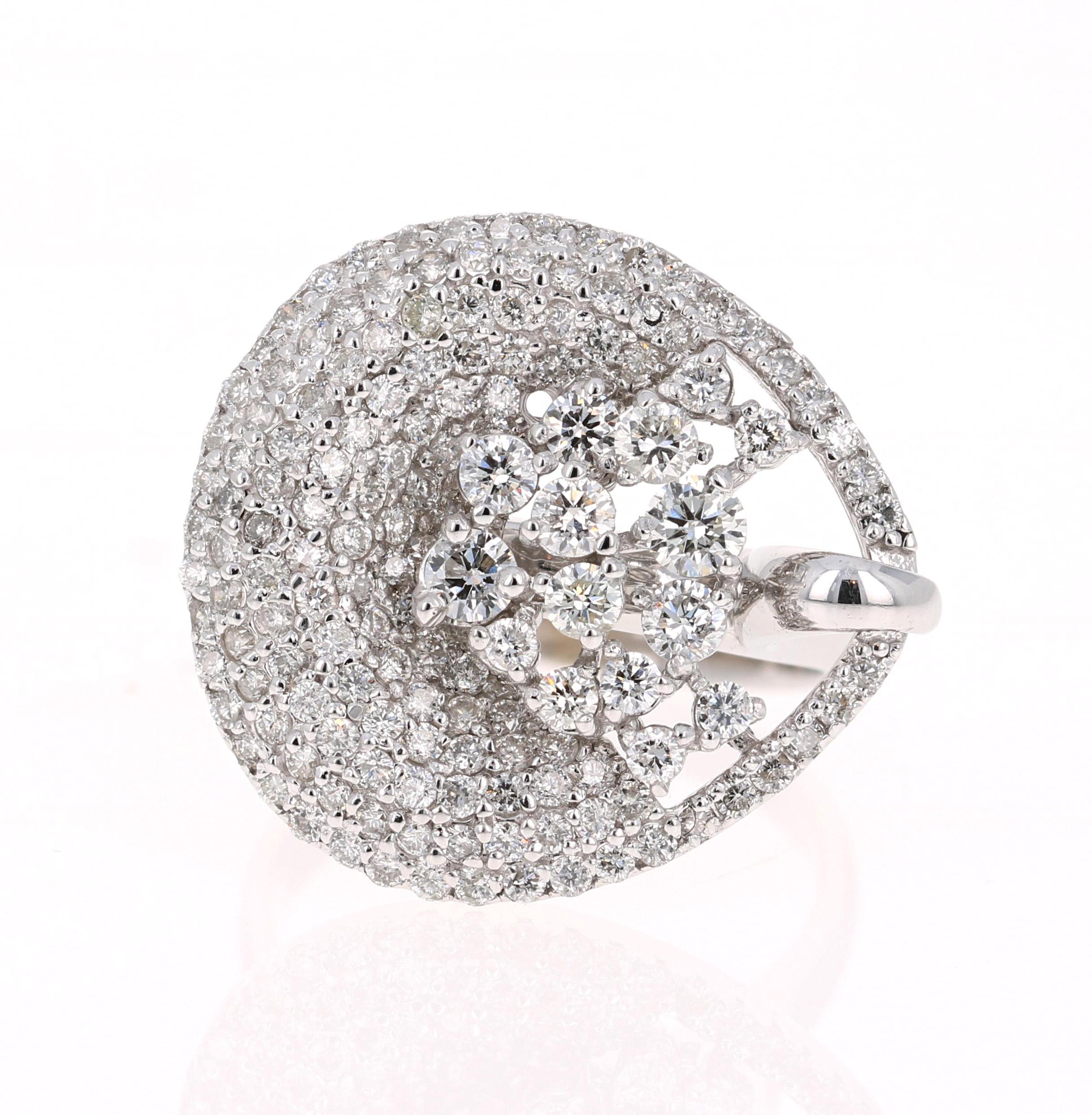 Classy Cocktail Ring with Diamonds. 

This ring has 162 Round Cut Diamonds that weigh 2.06 Carats and has a clarity and color of SI-F.  
It is crafted in 14 Karat White Gold and has an approximate weight of 8.4 grams. 

The ring is a size 7 and can