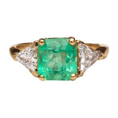 2.06 Carat Emerald and 1 Carat Trillion Diamond 3-Stone 14 Karat Gold Ring