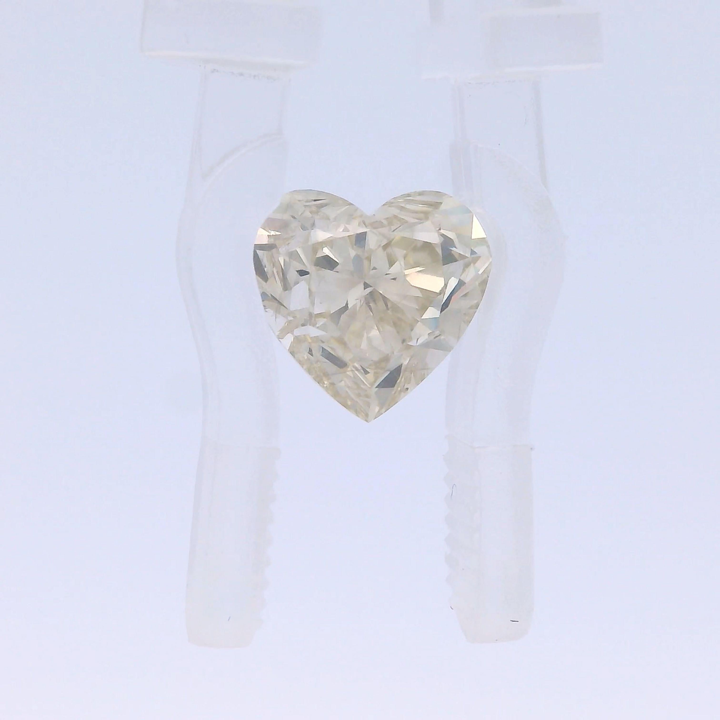 This exquisite 2.06 carat heart-shaped natural yellow diamond is a stunning example of nature's beauty. Expertly cut to perfection, it boasts exceptional clarity and a radiant yellow hue that captivates the eye.

Yellow diamonds are highly coveted