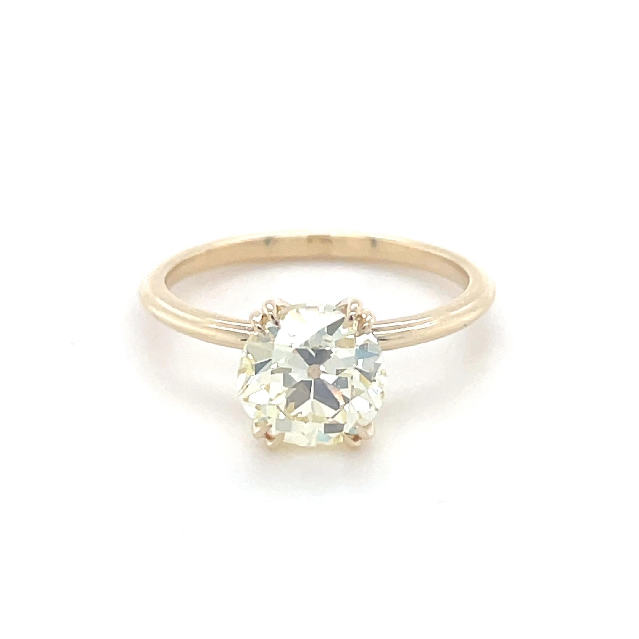 This gorgeous ring features a 2.06 carat old European cut diamond with a hint of warmth. Mounted within four double claw prongs and a triple ribbed band, this ring is elegant with a touch of history.

Ring Size: 7
Stamp: 14K
Metal: 14 karat yellow