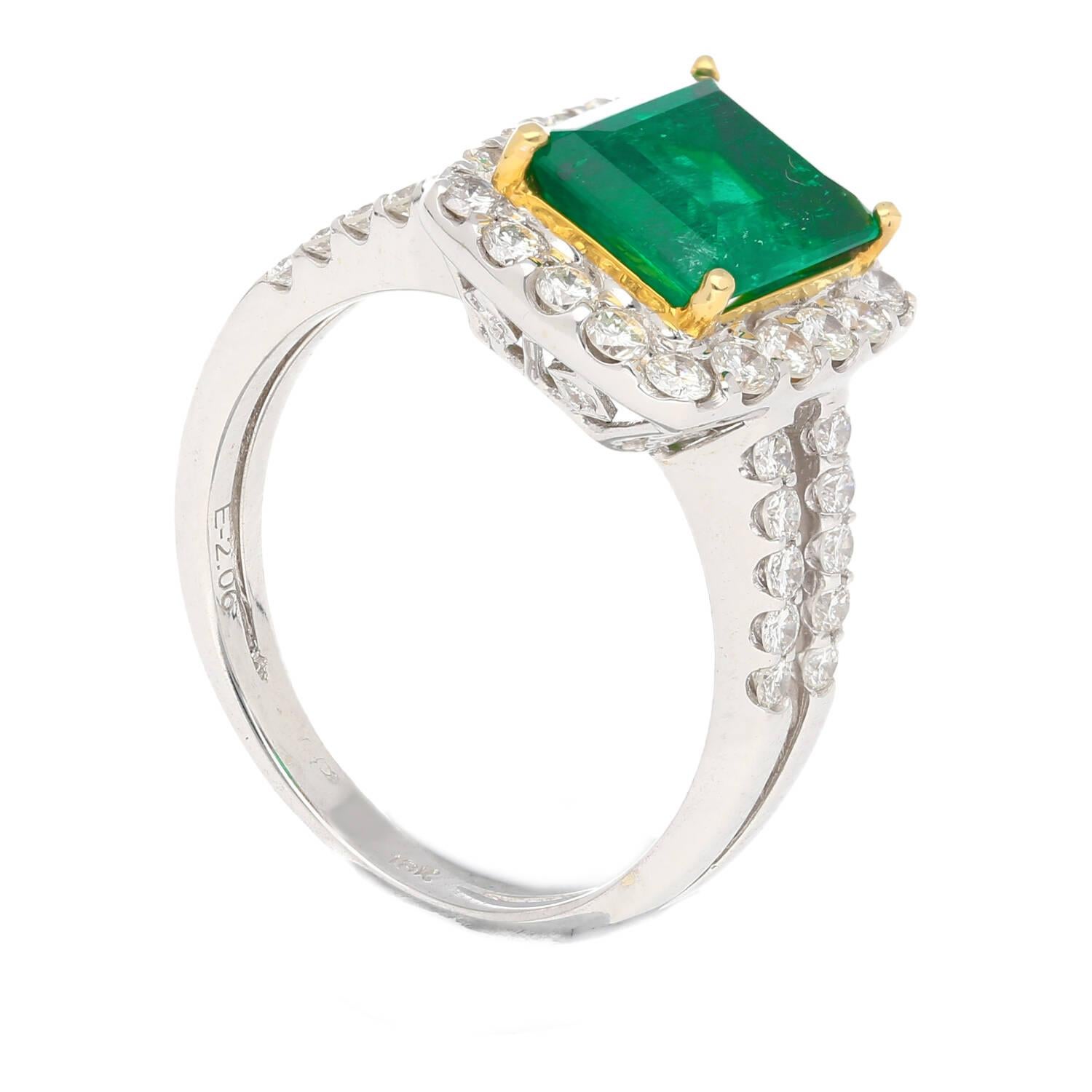 2.06 carat Old Mine Colombian Emerald and Diamond Halo with split shank diamond ring in 18K White. The 4-pronged setting and elegant design perfectly complement the rich green color of the emerald.

This Emerald was sourced from the legendary Muzo
