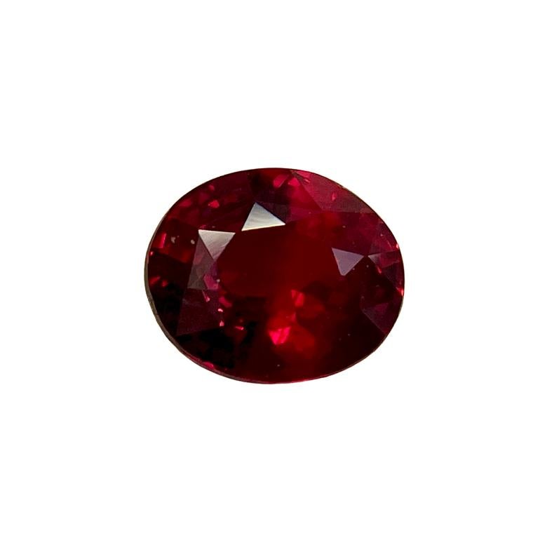 This is a deep red oval ruby mounted in a platinum ring with an 18K yellow gold basket and 0.41Ct of brilliant white half-moon diamonds. Suitable for any occasion!