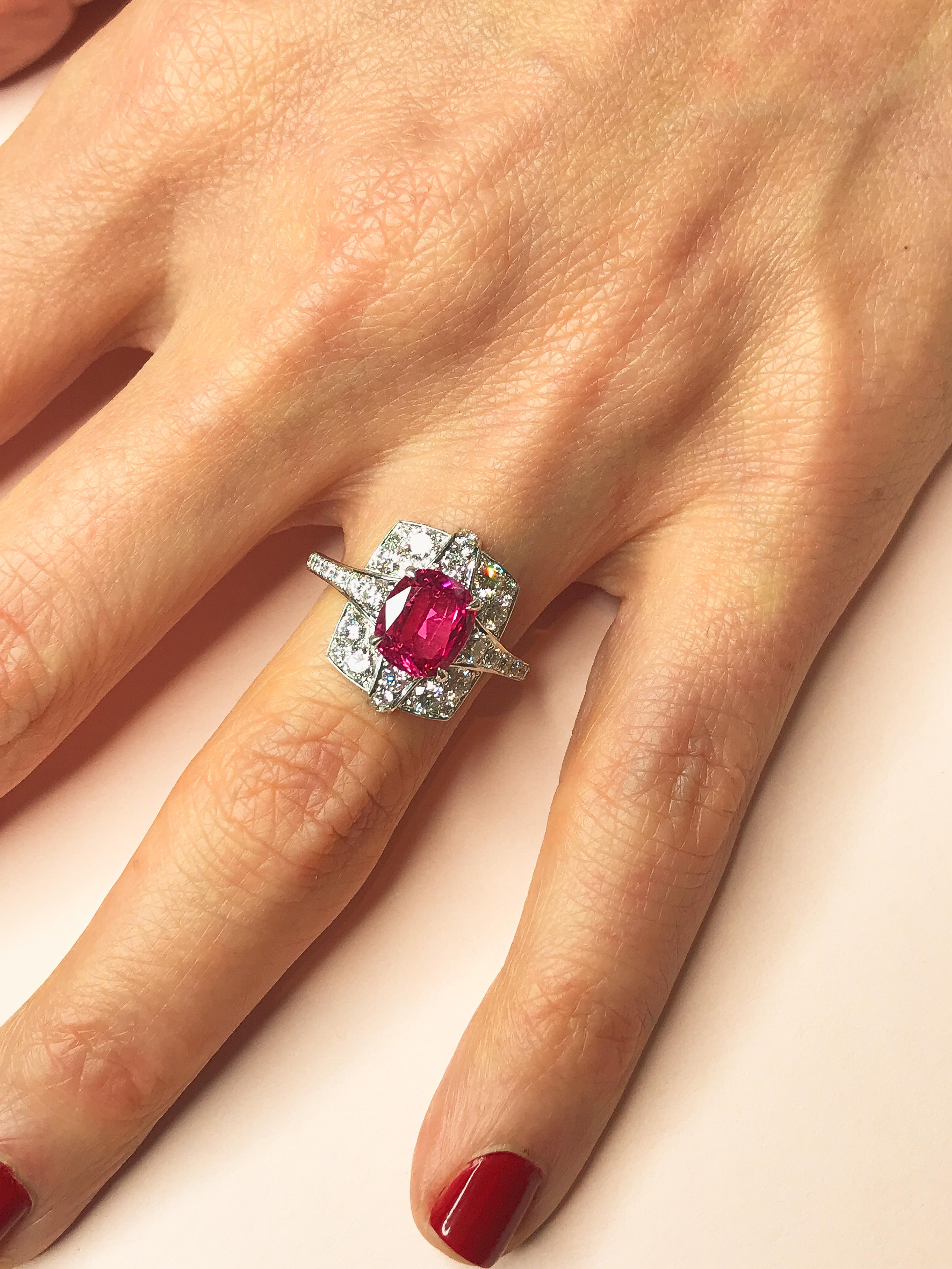 Pink spinels are certainly one of the hottest gemstones around and this stone has a fantastic hot pink colour. The ring is also truly unique, blending contemporary styling with classic design. This one of a kind cocktail ring brings together an