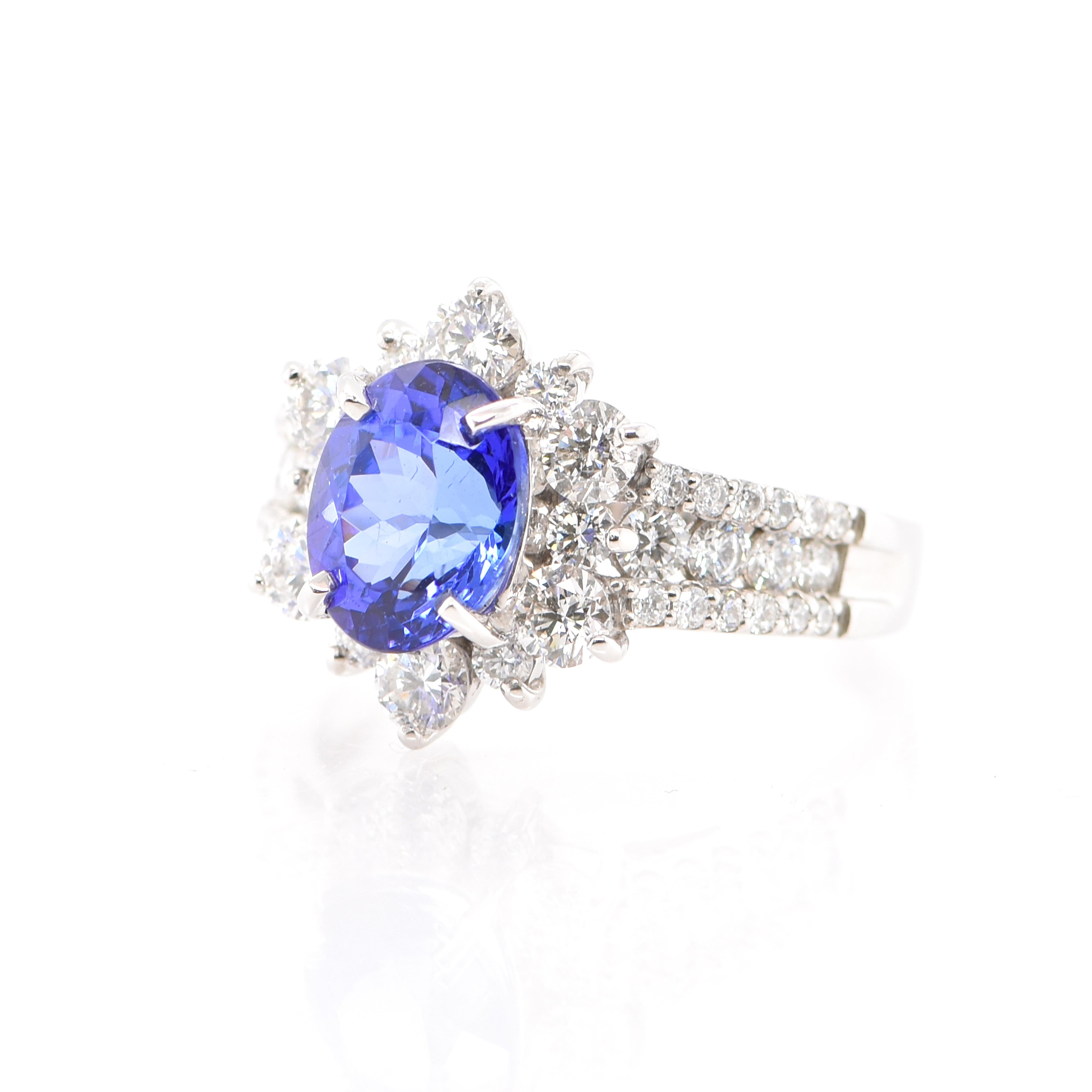 Modern 2.06 Carat Tanzanite and Diamond Halo Ring Set in Platinum