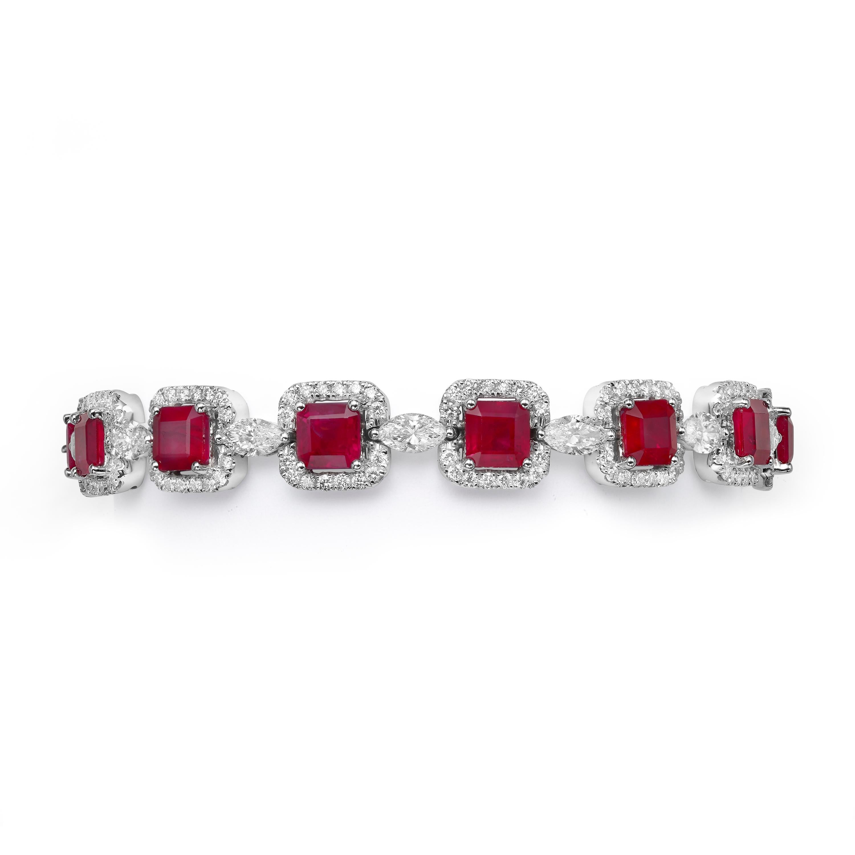 A ruby and diamond bracelet handcrafted from 18K white gold.  An octagon red ruby sits in the center of each link and is encircled by a glittering halo of white diamonds and glistening marquise-cut diamonds link each piece in the bracelet.  The