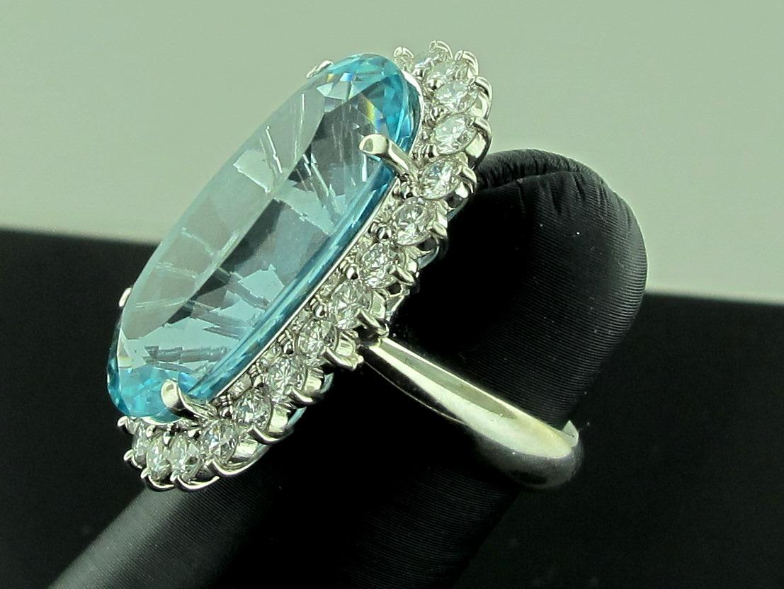 Oval Cut 20.63 Carat Oval Aquamarine Surrounded by Diamonds in Platinum For Sale