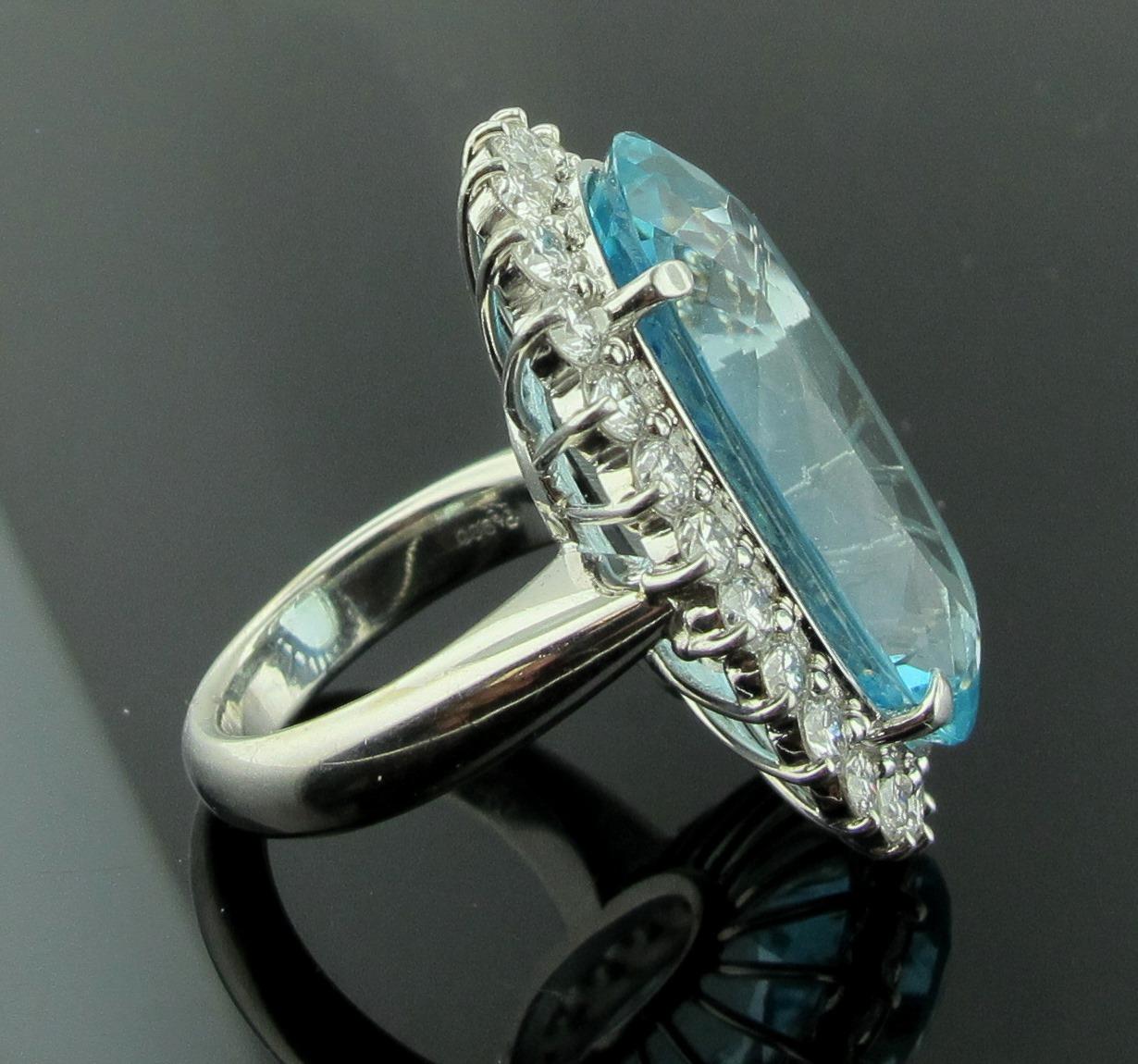 Women's or Men's 20.63 Carat Oval Aquamarine Surrounded by Diamonds in Platinum For Sale