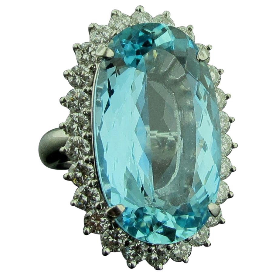 20.63 Carat Oval Aquamarine Surrounded by Diamonds in Platinum For Sale