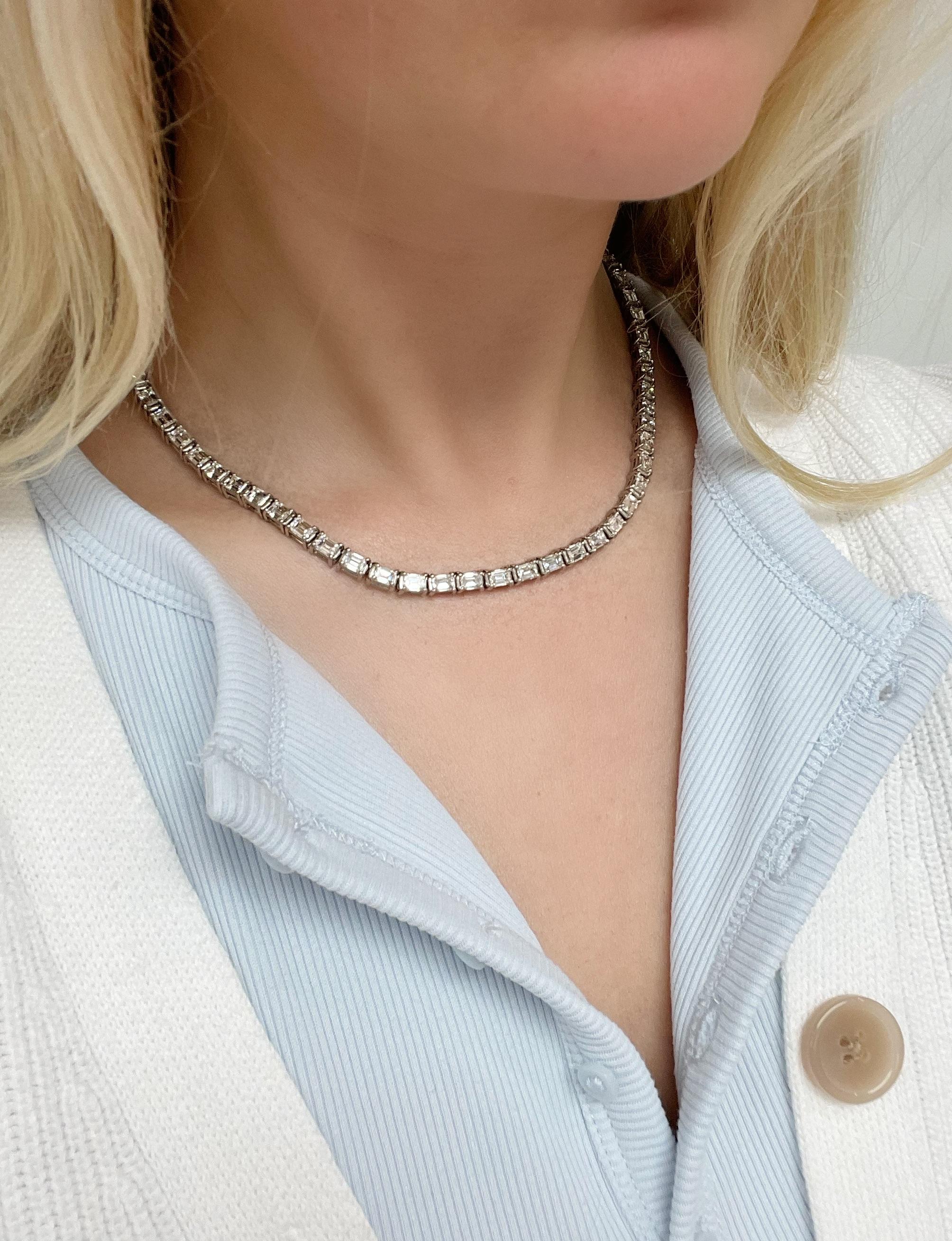 This gorgeous diamond necklace boasts 66 emerald cut diamonds weighing 20.64 carats total. Mounted east west in platinum, this necklace gives a modern twist to the classic riviere necklace that is sure to wow!

Total length: 16 inches
Material: