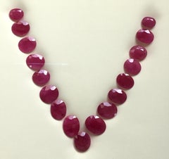 206.42 Carats Ruby Mozambique Oval Faceted Cut stone Layout Heated Natural Gem