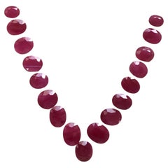 206.42 Carats Ruby Mozambique Oval Faceted Cut stone Layout Heated Natural Gem